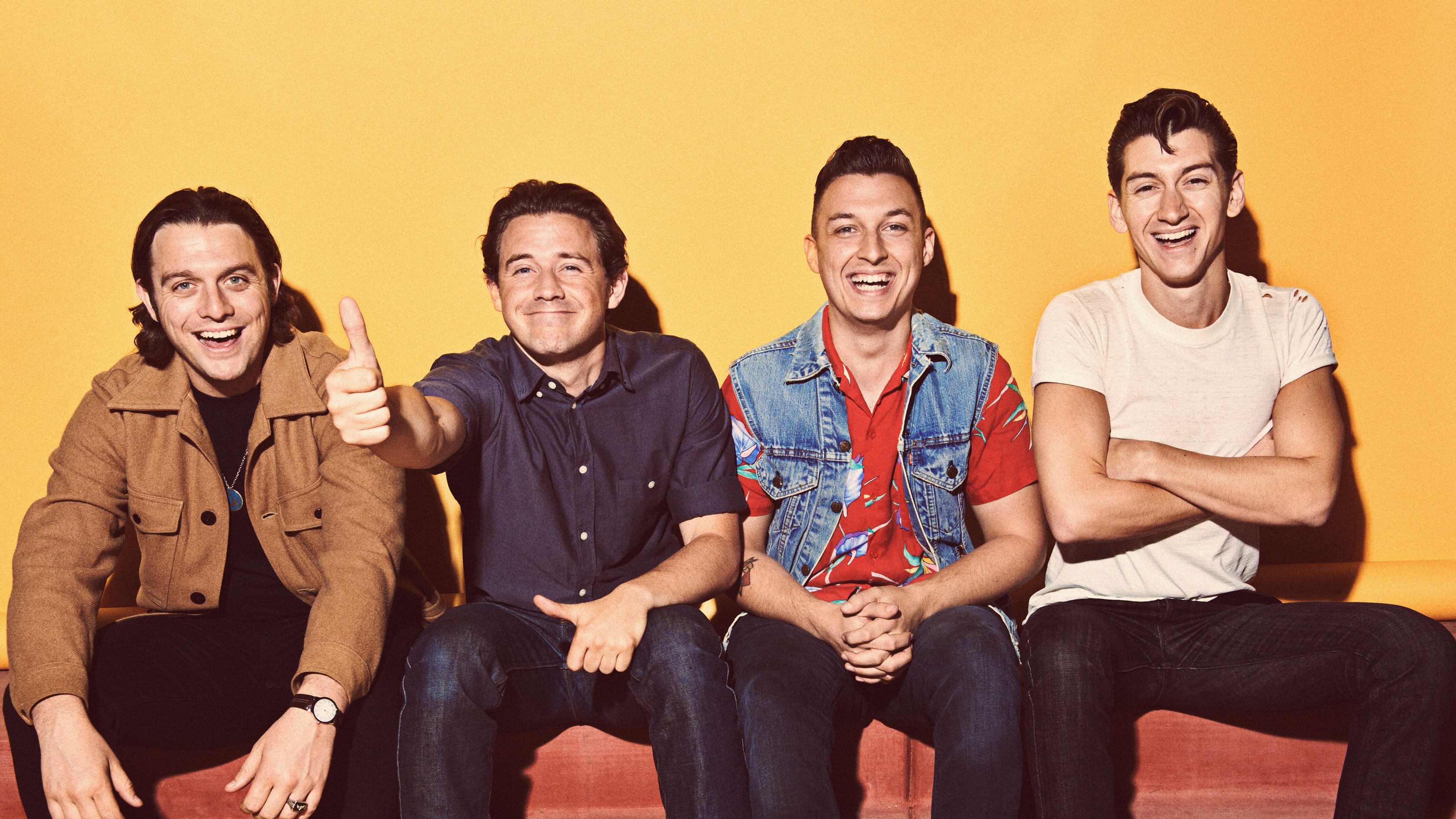 People 3360x1890 Arctic Monkeys men smiling music sitting group of men yellow background men indoors hand gesture band simple background