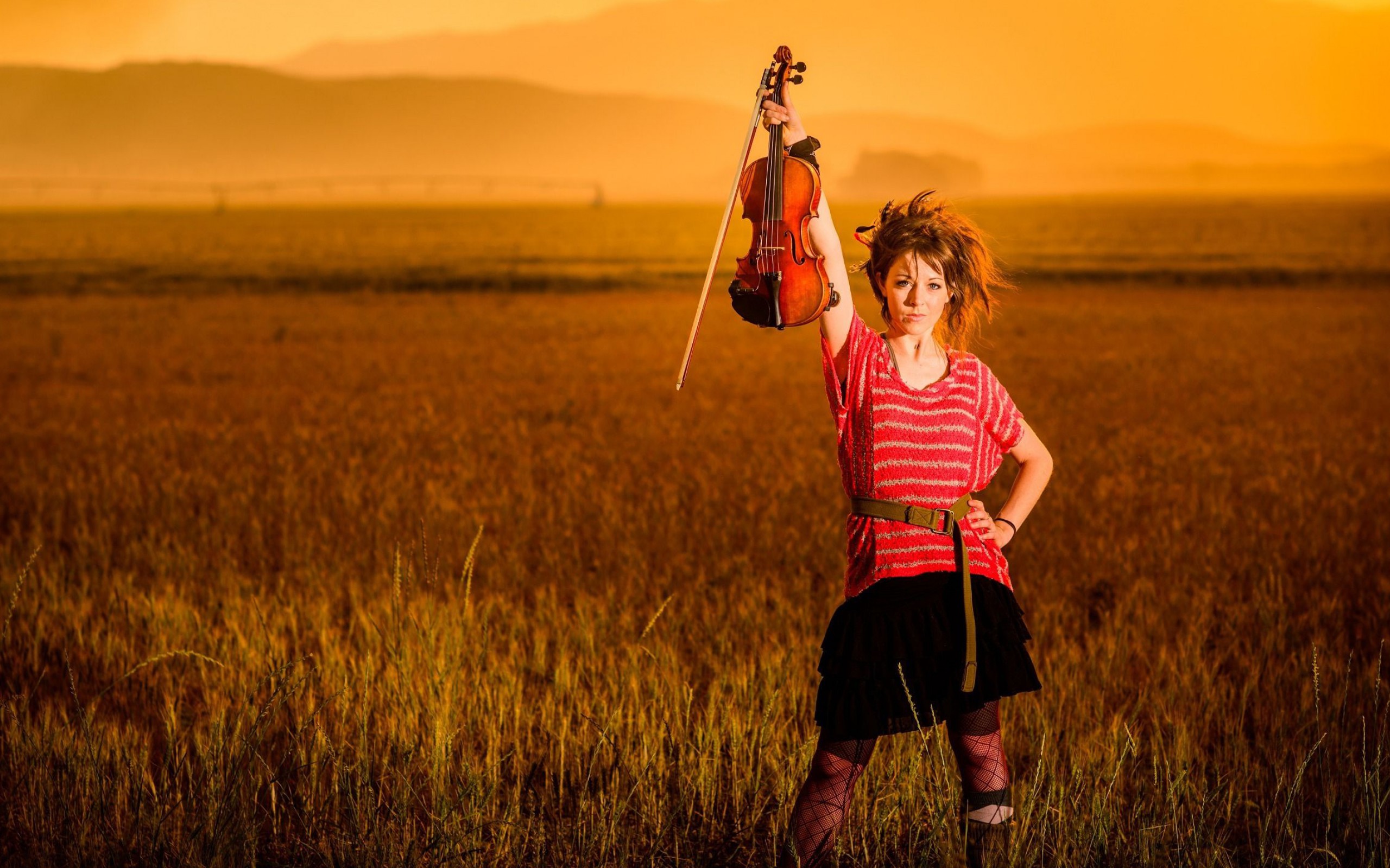 People 2560x1600 Lindsey Stirling musician violin women brunette sunset field looking at viewer women outdoors musical instrument