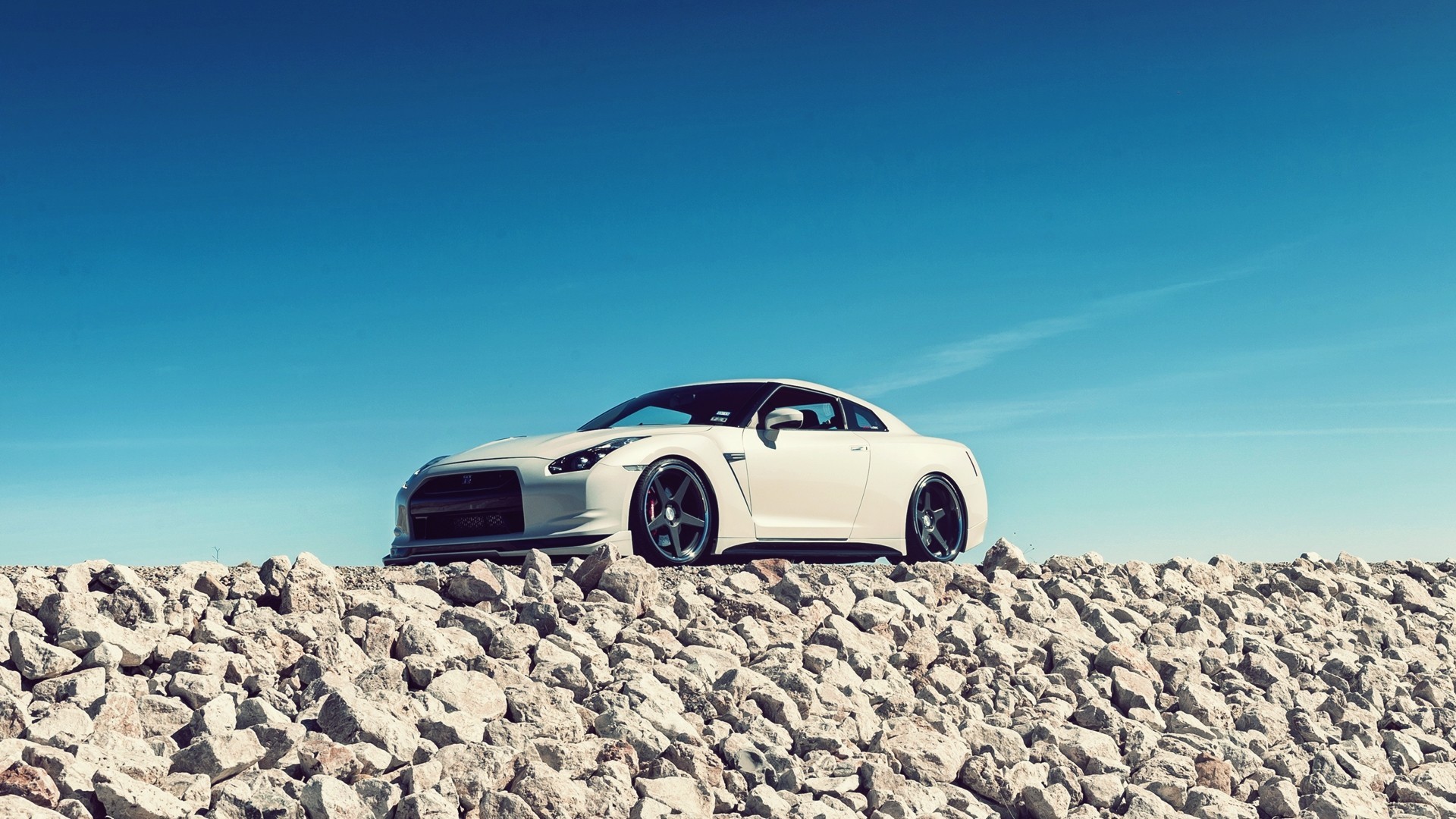 General 1920x1080 Nissan GT-R car Nissan white cars stones sky vehicle