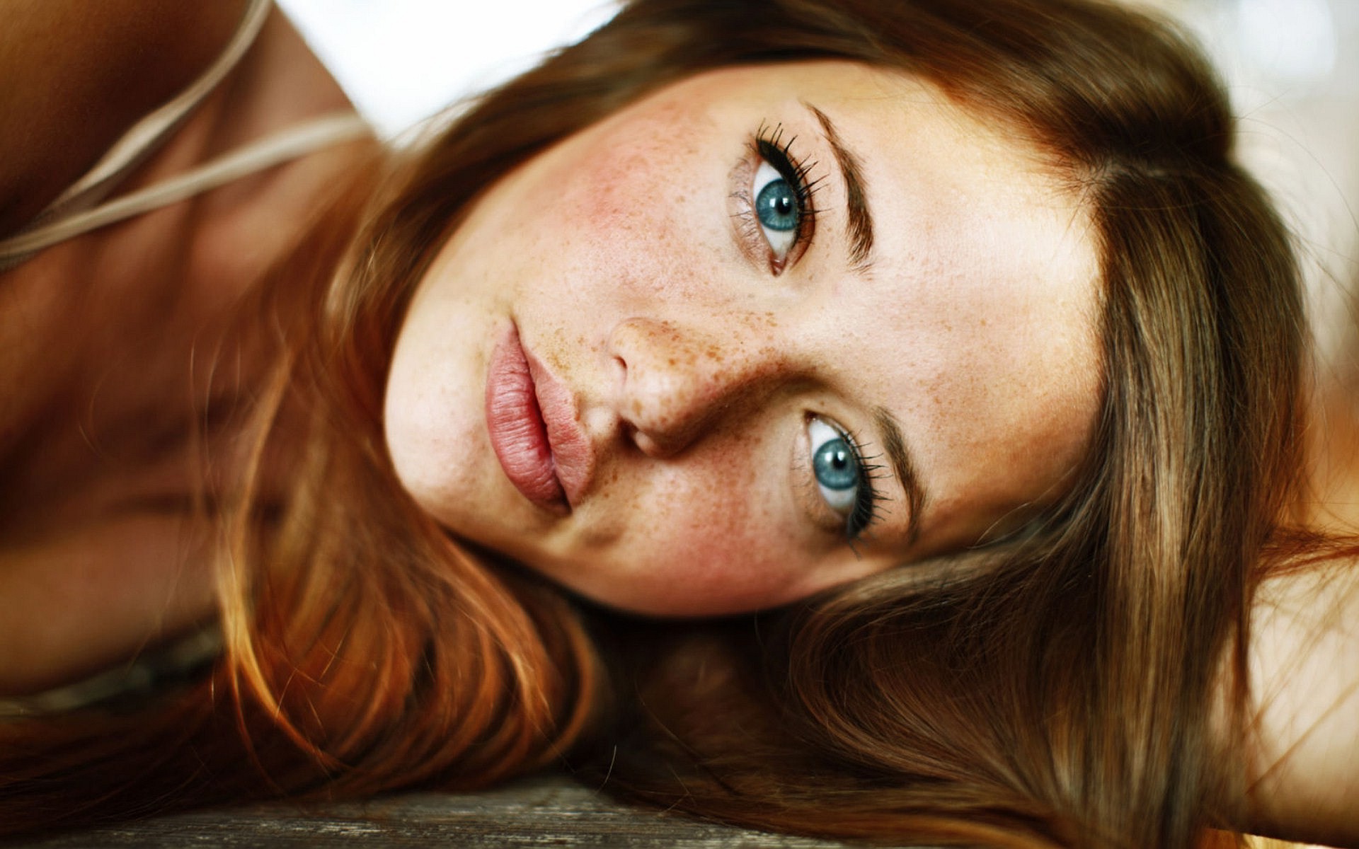 People 1920x1200 Lindsay Hansen freckles women face redhead blue eyes lying down looking at viewer