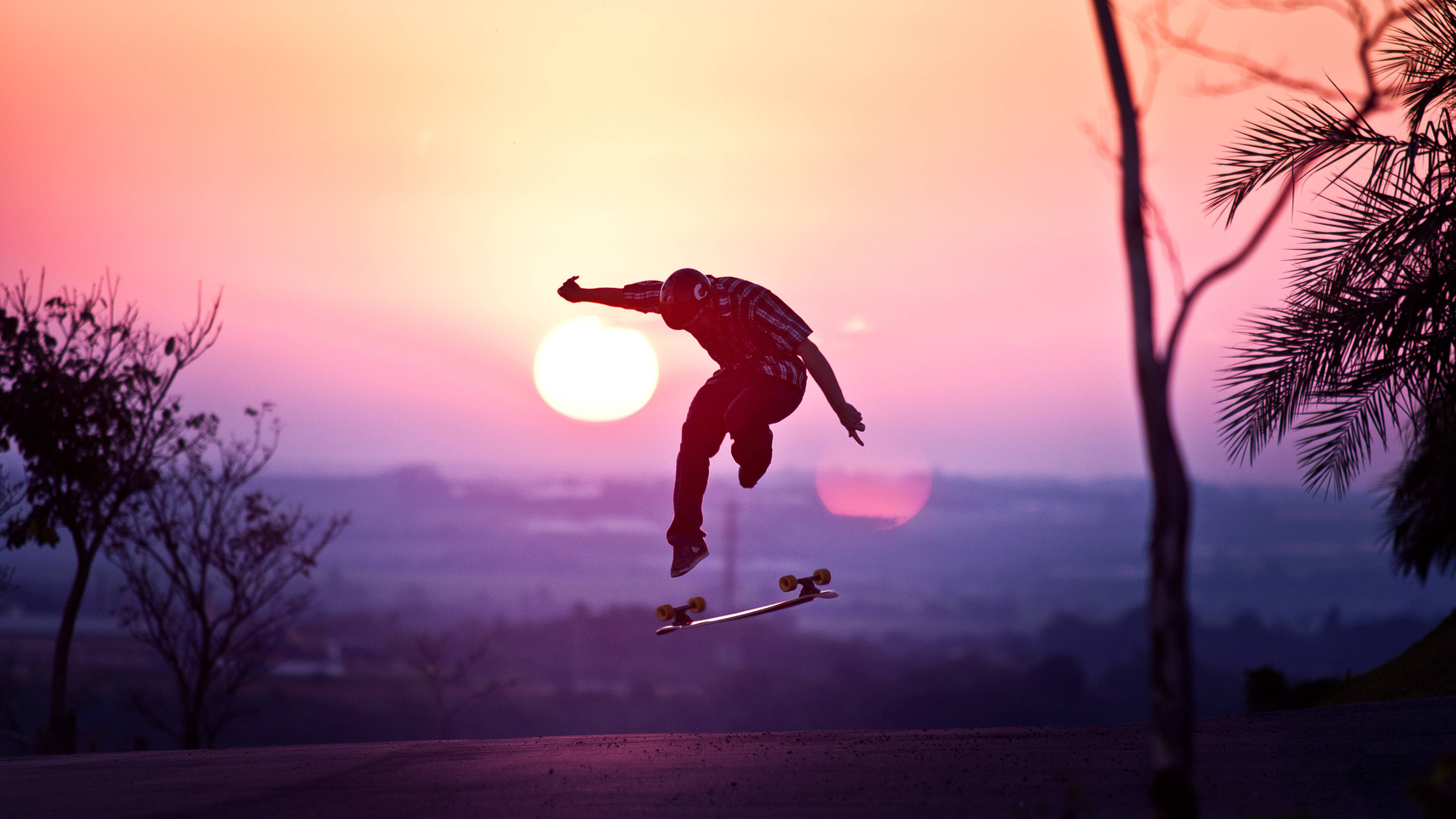 General 2560x1440 skateboard sunset asphalt outdoors jumping low light