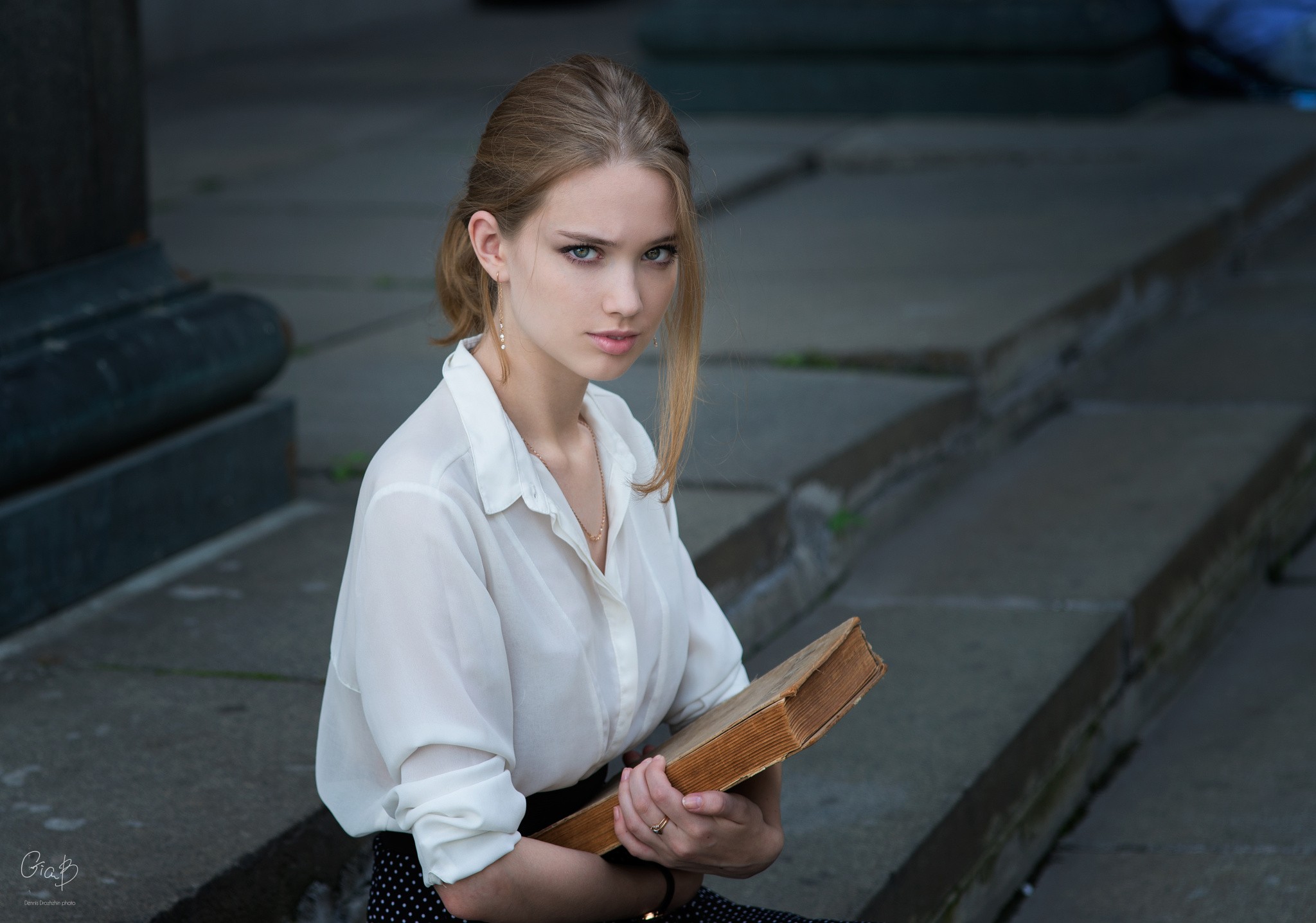 People 2048x1436 women model face portrait blonde blue eyes sitting books looking at viewer women outdoors pale outdoors white shirt white clothing Dennis Drozhzhin