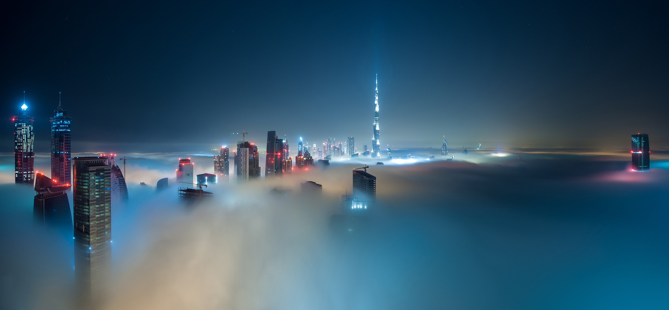 General 2327x1080 city building mist Dubai Burj Khalifa skyscraper clouds night United Arab Emirates sky city lights lights 500px cityscape blue