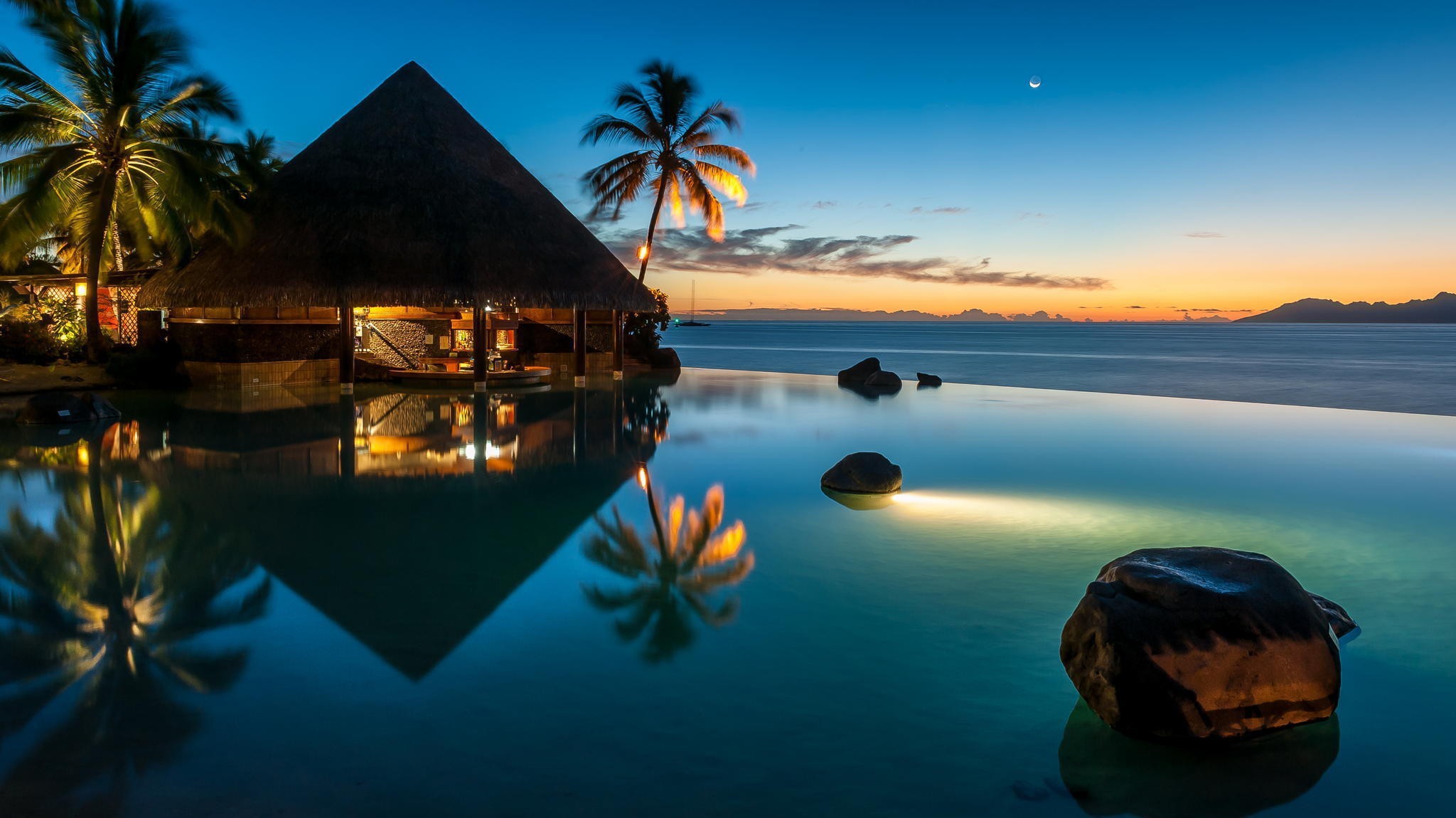 General 2048x1150 bungalow palm trees sea sunset horizon resort reflection rocks hut