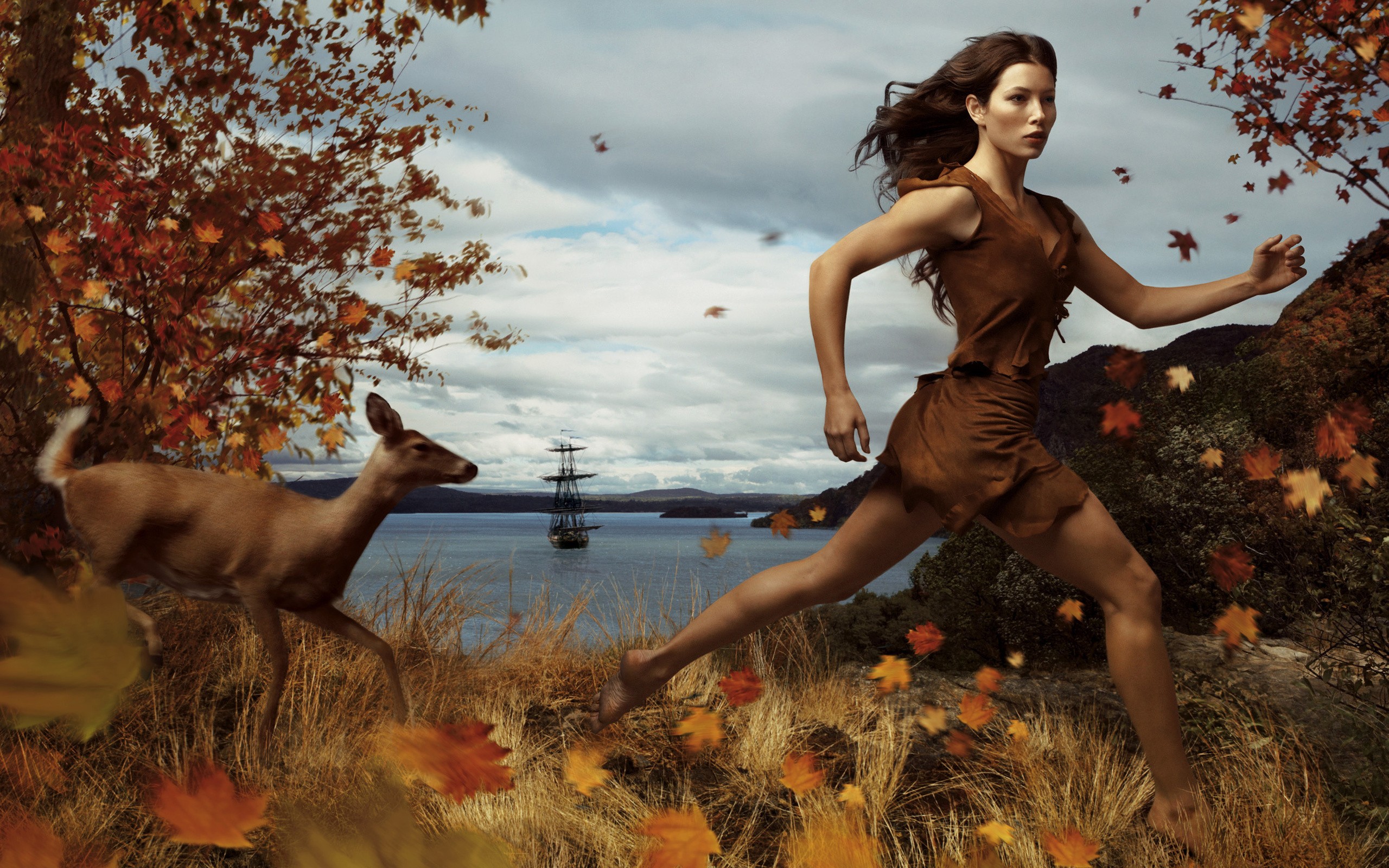 People 2560x1600 women brunette long hair women outdoors nature trees fall leaves running fictional animals fawns sea sailing ship bay clouds mountains hills grass motion blur windy open mouth mythology deer mammals Jessica Biel actress celebrity Annie Leibovitz Pocahontas