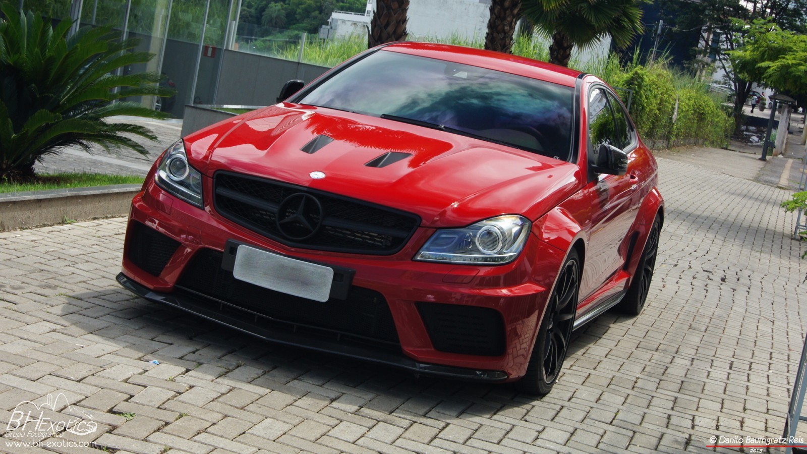 General 1600x900 car sports car Mercedes-Benz coupe vehicle red cars Mercedes-Benz C63 AMG frontal view headlights watermarked 2013 (Year)