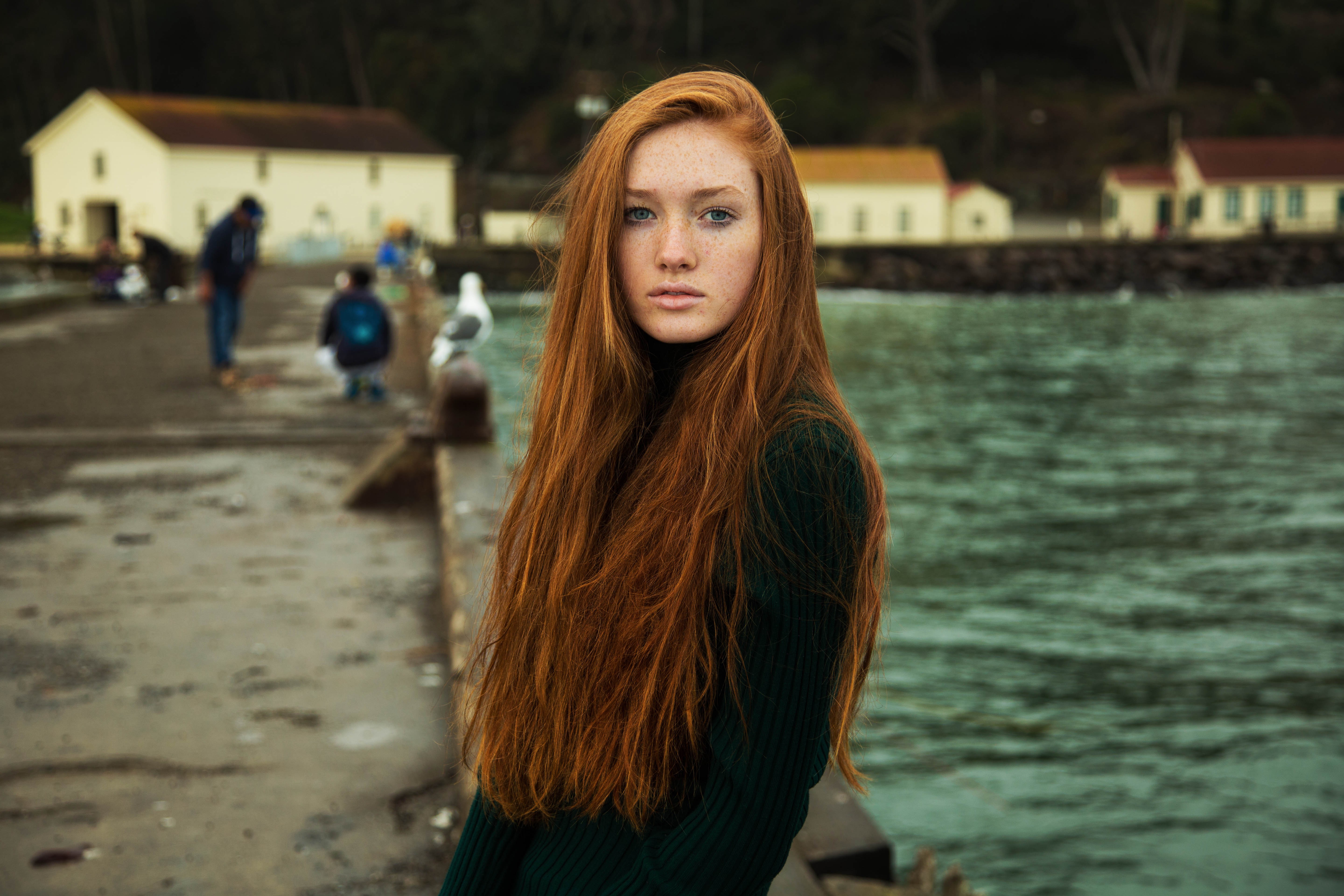 People 5760x3840 redhead freckles women long hair women outdoors sweater sea blue eyes looking at viewer Mihaela Noroc San Francisco green sweater