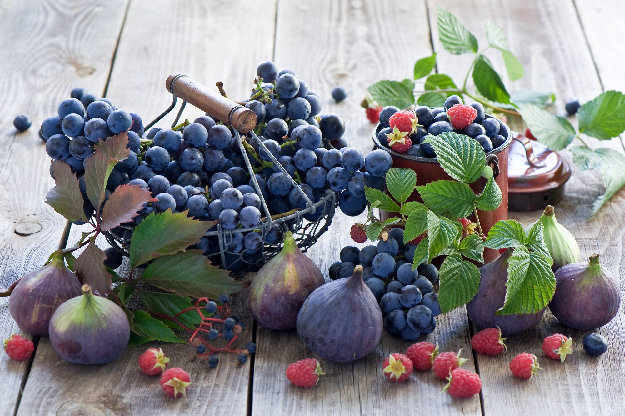 General 2000x1331 food fruit grapes wooden surface baskets berries raspberries Black Grapes closeup