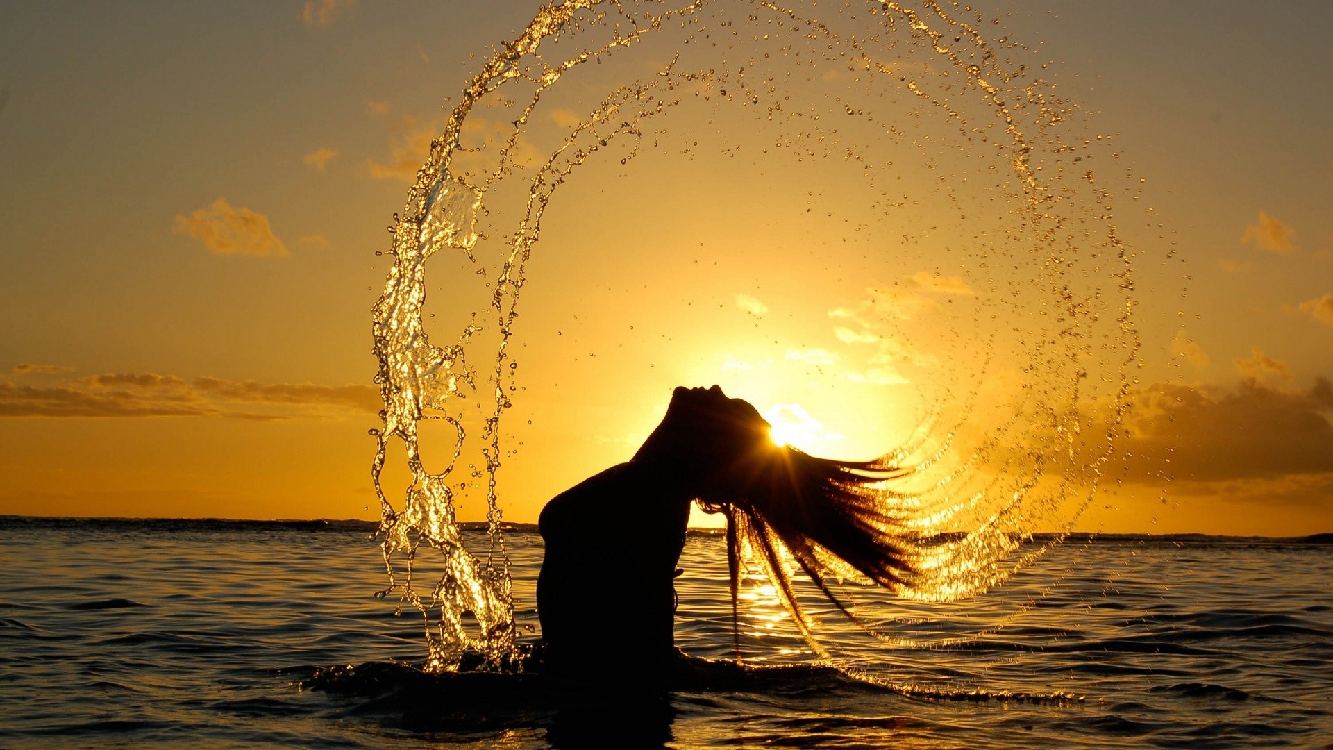 People 1920x1080 women wet body wet hair Sun sunset silhouette water drops sea sky model long hair splashes photography women outdoors in water water orange sky sunlight