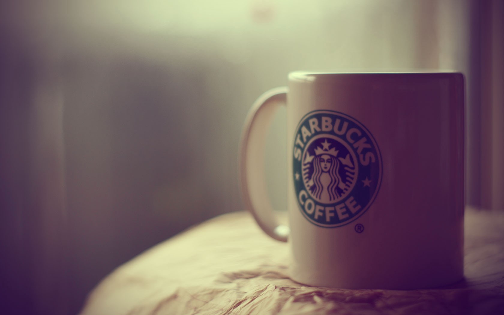 General 1680x1050 Starbucks cup mug logo indoors brand closeup