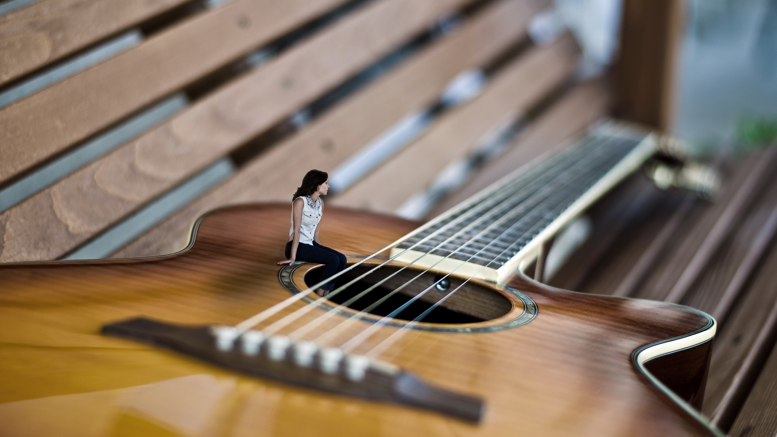 General 2560x1440 wood wooden surface planks bench guitar women macro photo manipulation miniatures depth of field photoshopped jeans sitting looking away shirt musical instrument