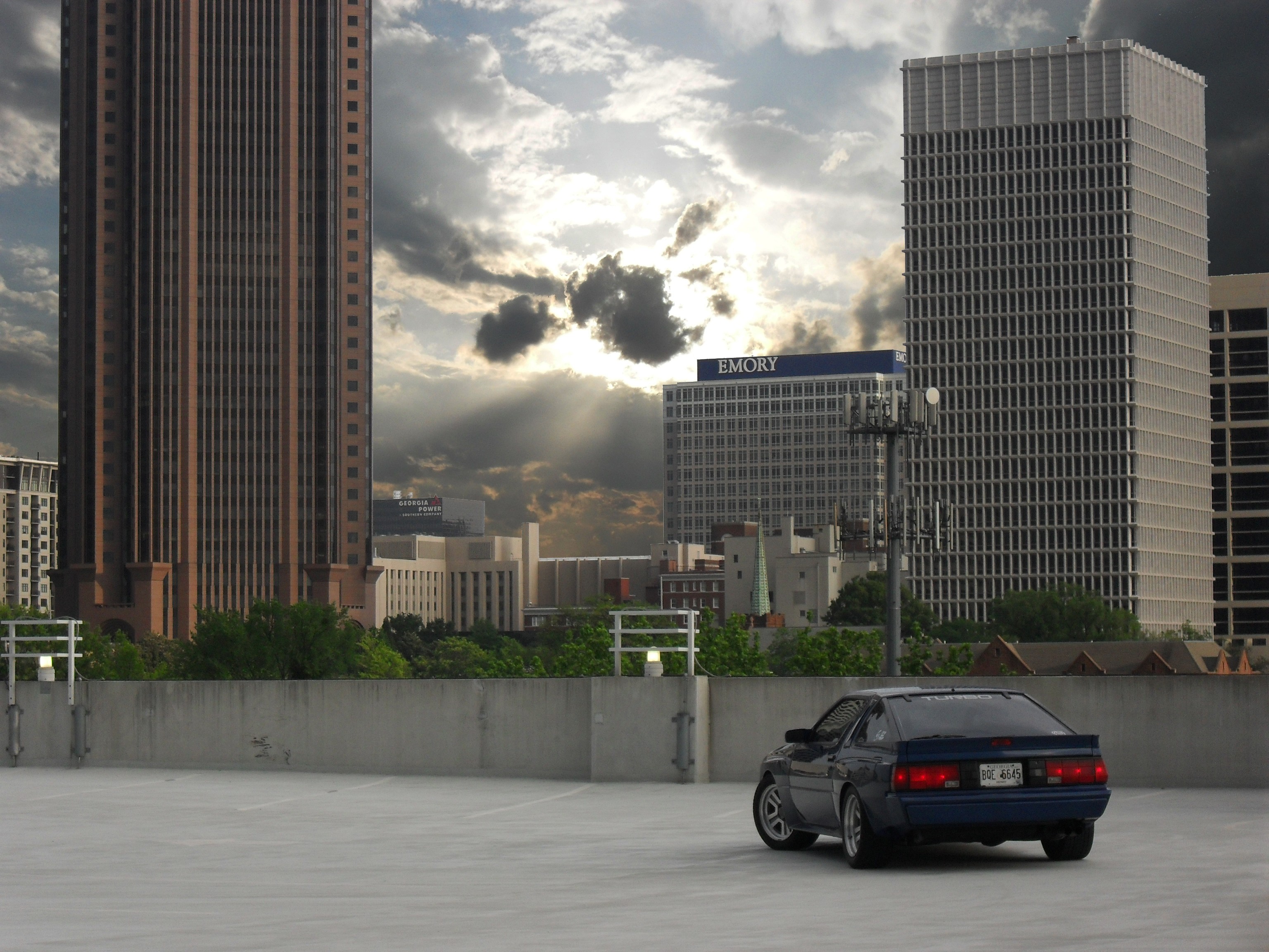 General 3072x2304 Mitsubishi cityscape blue cars mitsubishi starion Japanese cars building sky car vehicle sunlight clouds rear view licence plates trees taillights city skyscraper