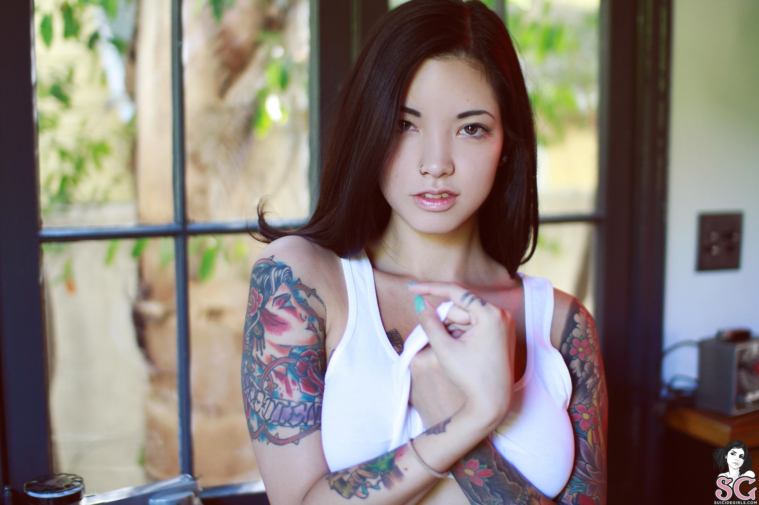 People 2560x1706 women tattoo face piercing Myca Suicide inked girls Suicide Girls makeup cyan nails women indoors brunette looking at viewer painted nails brown eyes watermarked
