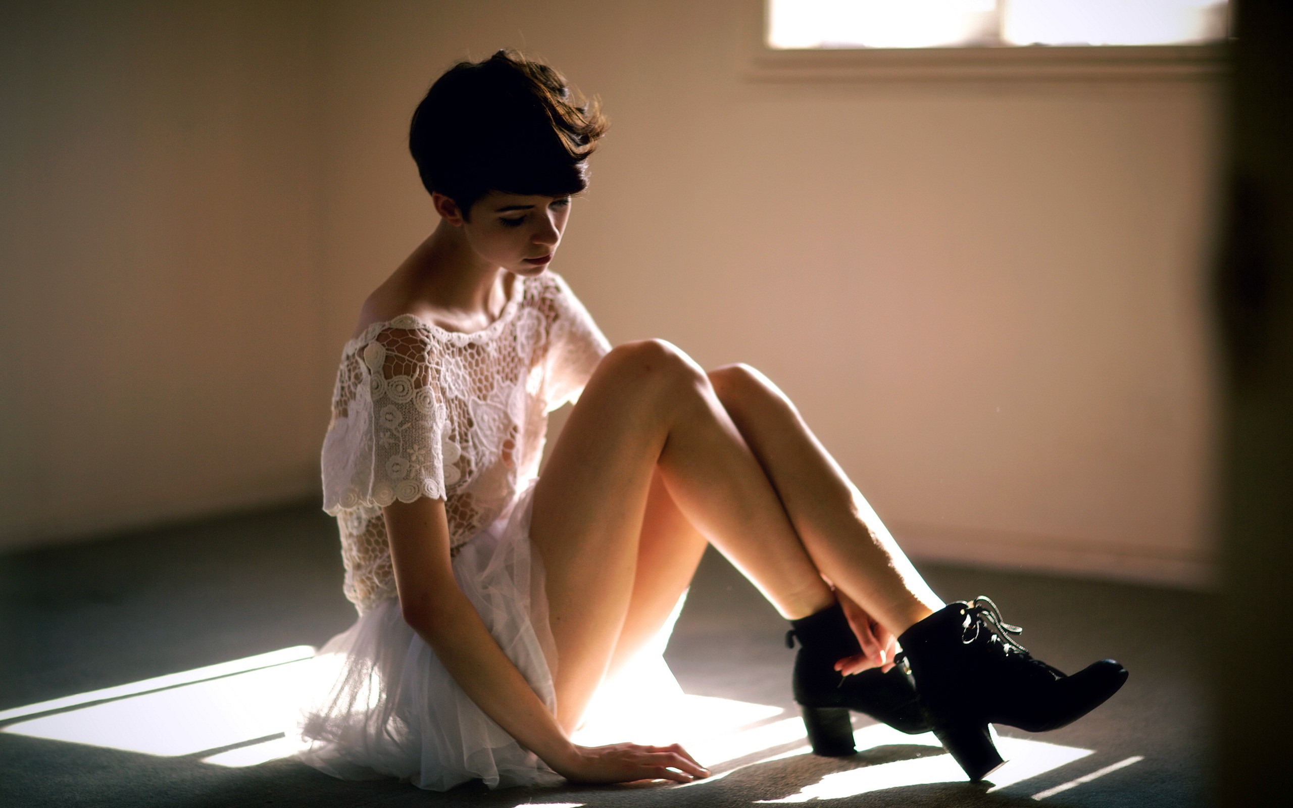People 2560x1600 women short hair boots see-through clothing model sitting legs looking away white dress dress white clothing women indoors on the floor