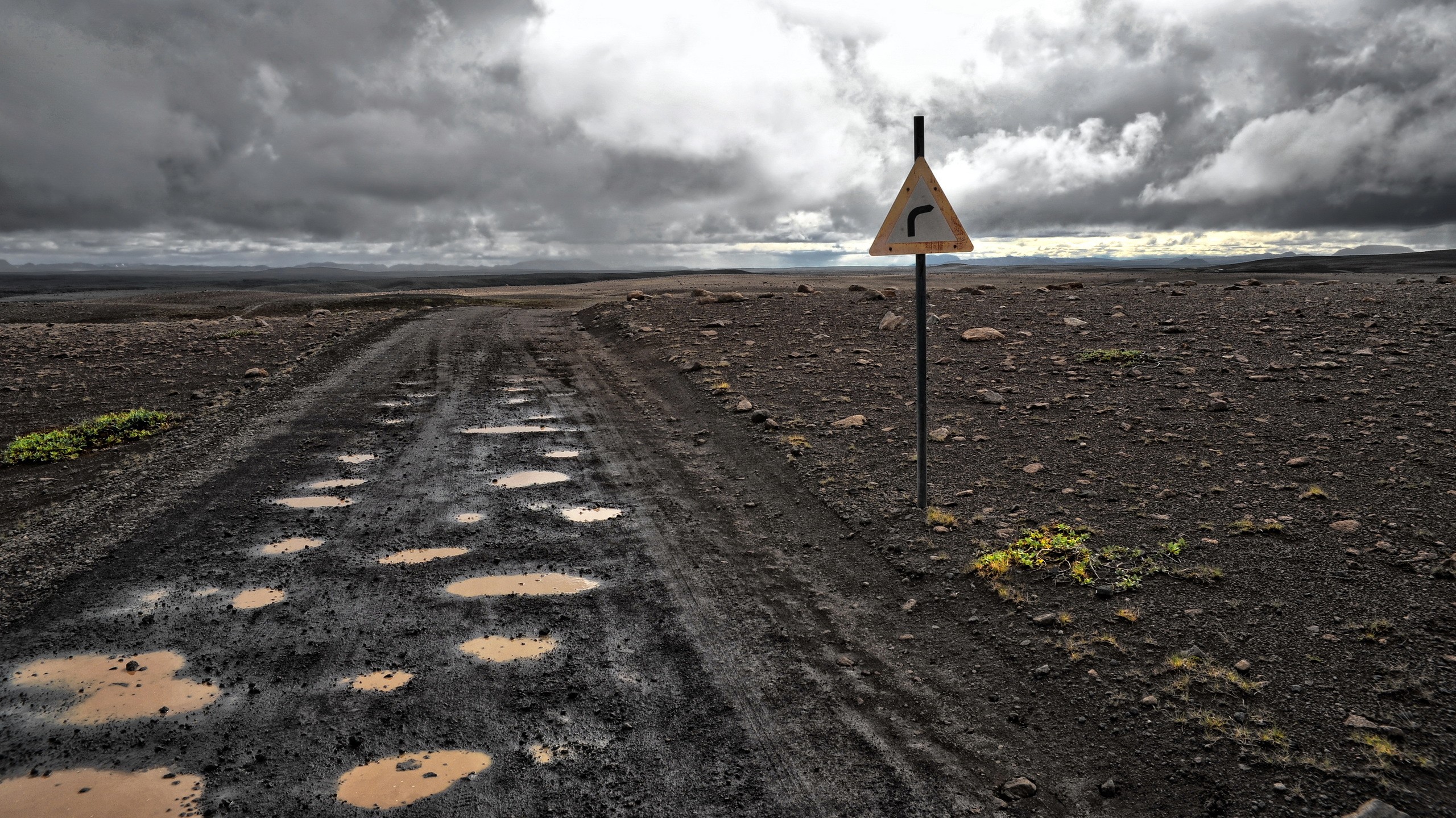 General 2560x1440 landscape mud road sign dirt road puddle dirt plains outdoors clouds
