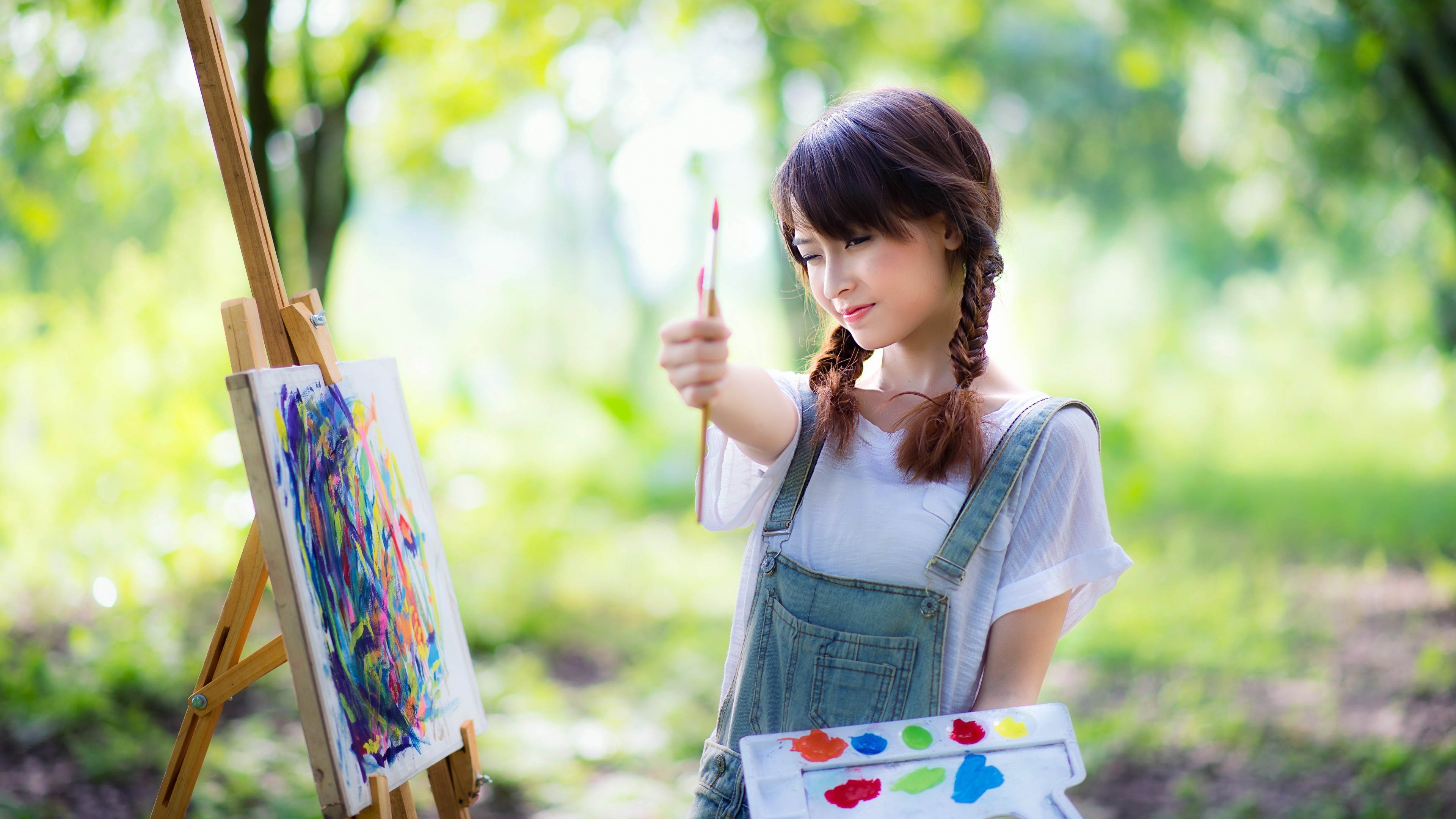 People 3840x2160 women brunette Asian long hair women outdoors painting painters nature jeans T-shirt trees depth of field abstract thumbs up easel twintails paint brushes outdoors