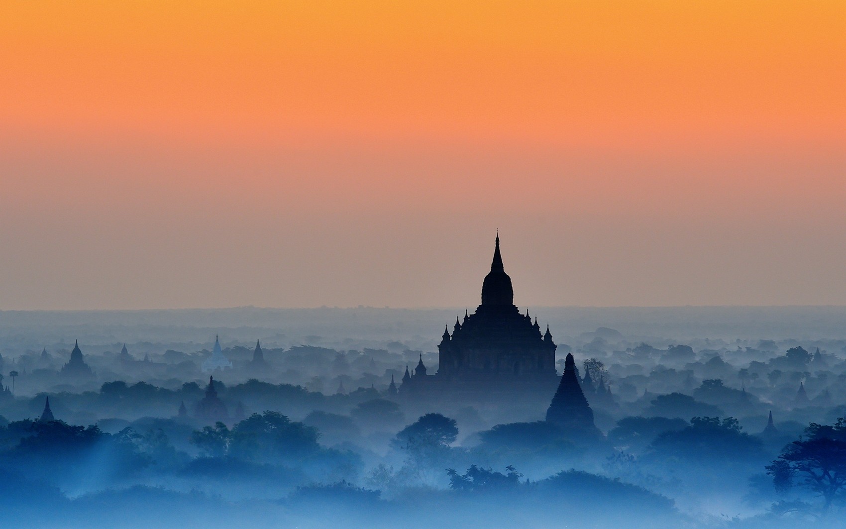 General 1700x1063 nature landscape Bagan temple mist blue trees amber sky Buddhism Myanmar orange sky Asia