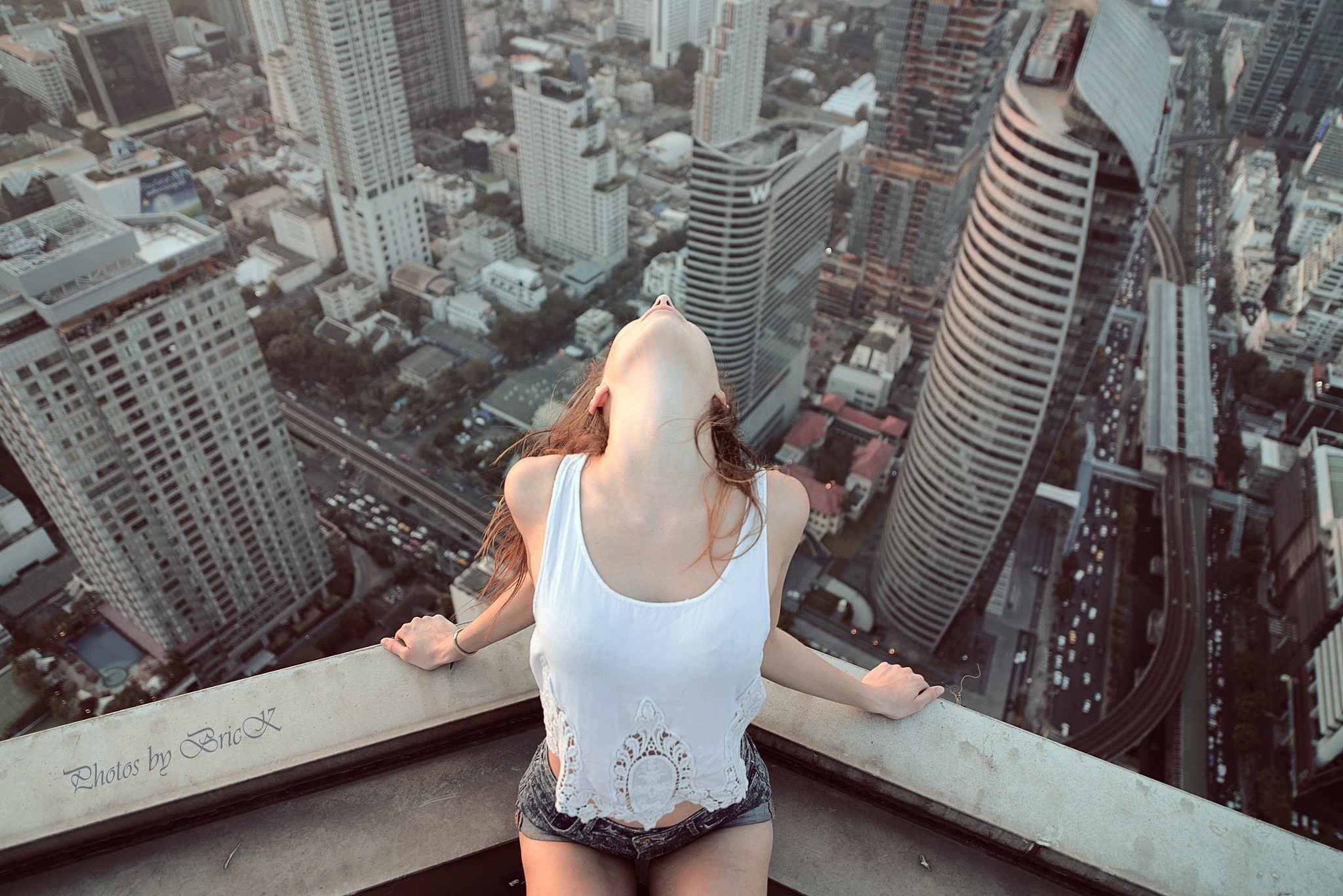 People 2048x1367 women cityscape women outdoors rooftops aerial view tank top white tank top crop top leaned back hair hanging down shorts jean shorts watermarked urban 500px