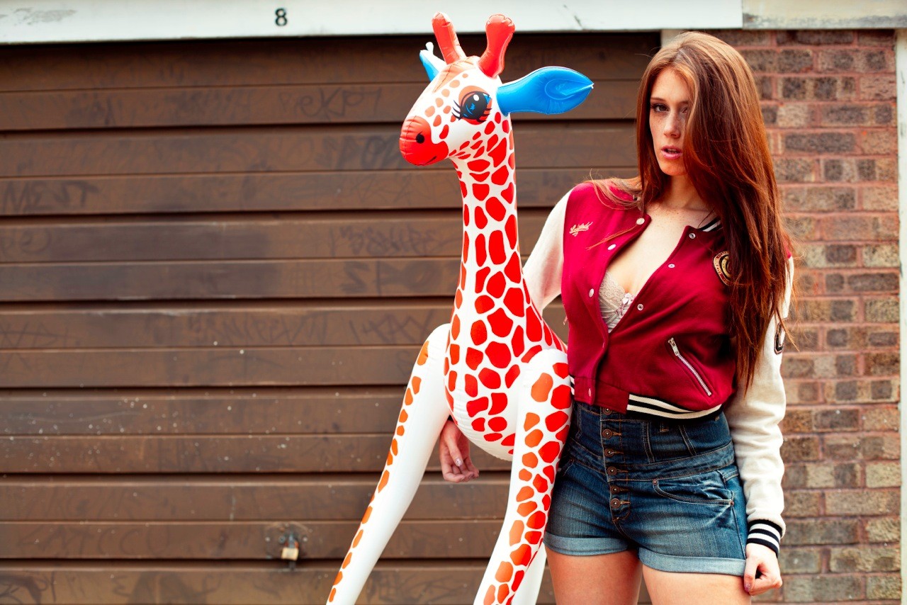 People 1280x854 Charlotte Herbert redhead jean shorts bra women hair in face giraffes animals toys standing outdoors sweatshirts open clothes model