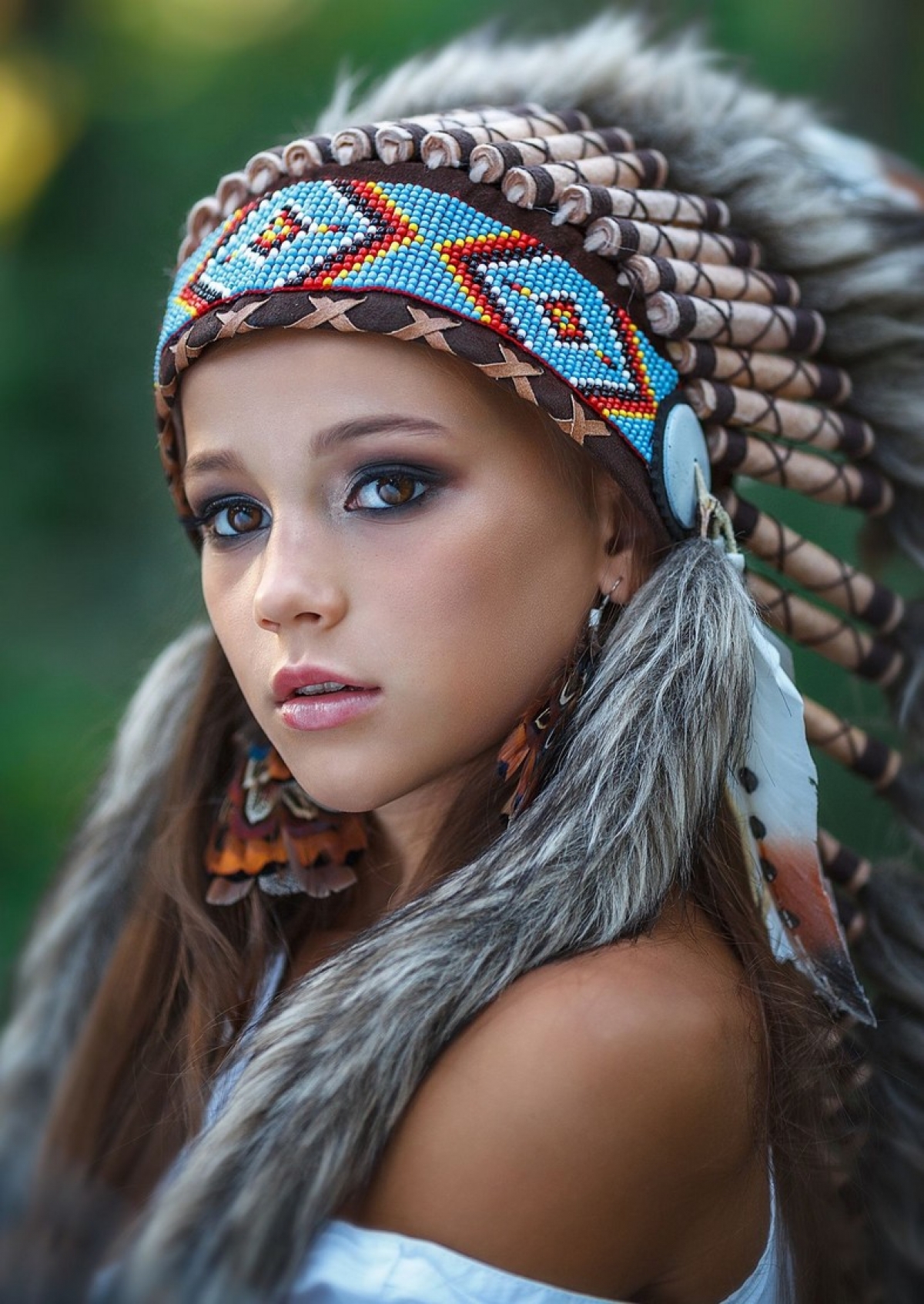 People 1200x1694 brunette long hair portrait display feathers Native American clothing brown eyes headband women outdoors face fur bare shoulders smoky eyes sacrilege headdress women closeup