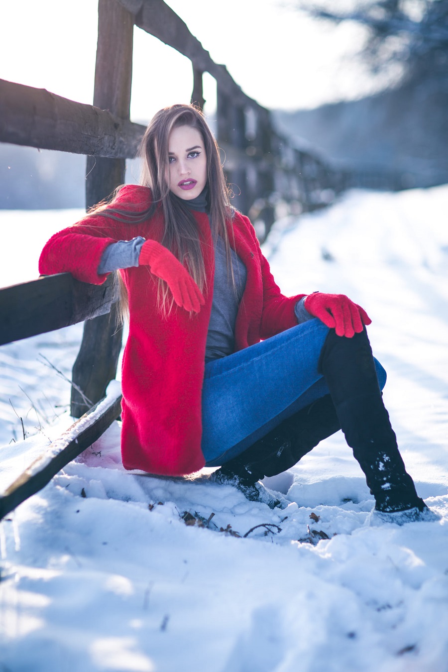 People 900x1350 women brunette long hair straight hair red coat coats snow grey sweater gloves Melania snow boots blue pants blue  jeans black boots red gloves winter Winter Women