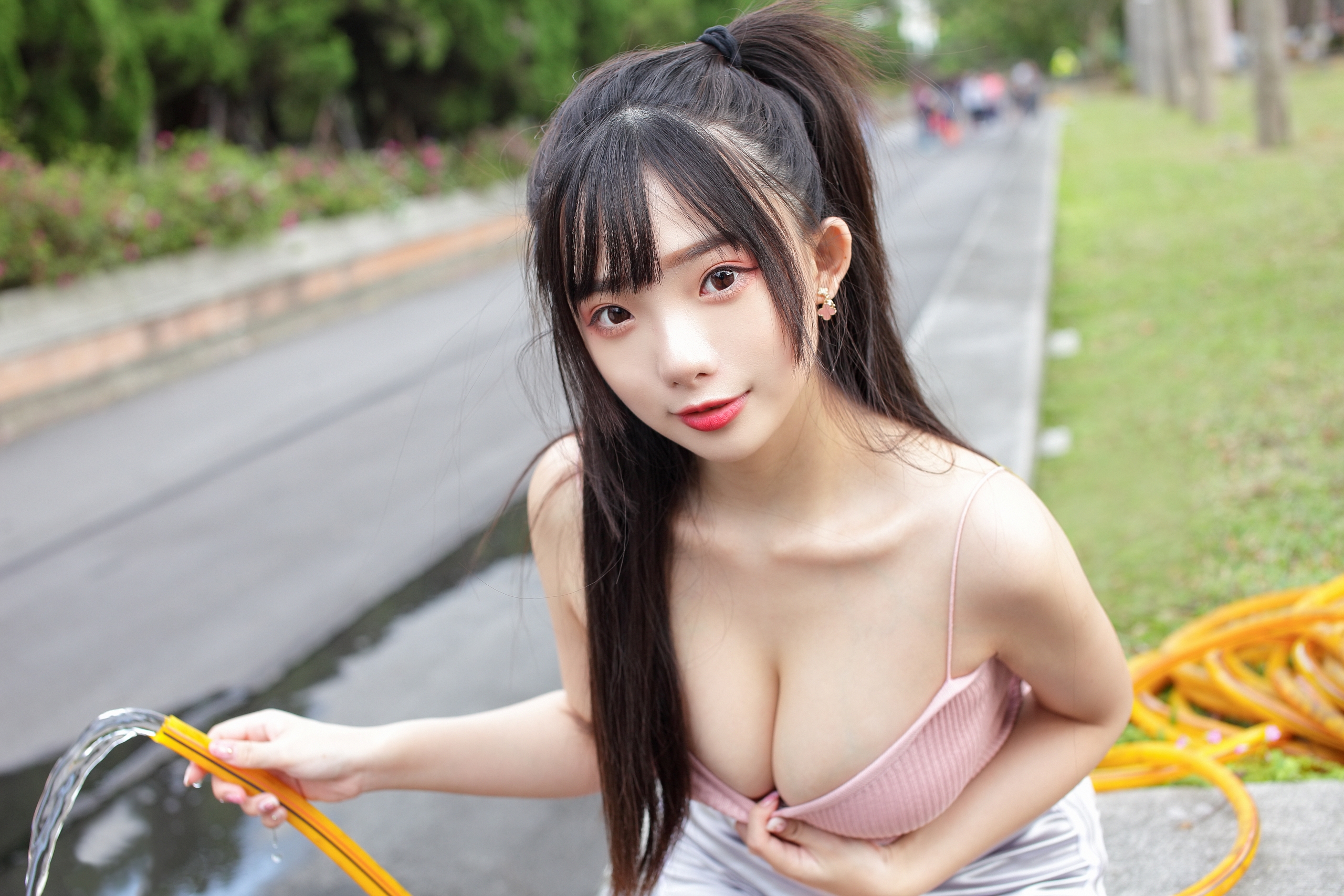 People 2560x1707 Asian women model brunette bangs portrait looking at viewer ponytail smiling cleavage pulling clothing water hose depth of field street brown eyes tank top pink tops outdoors Chinese black hair Chinese model Ning Shioulin