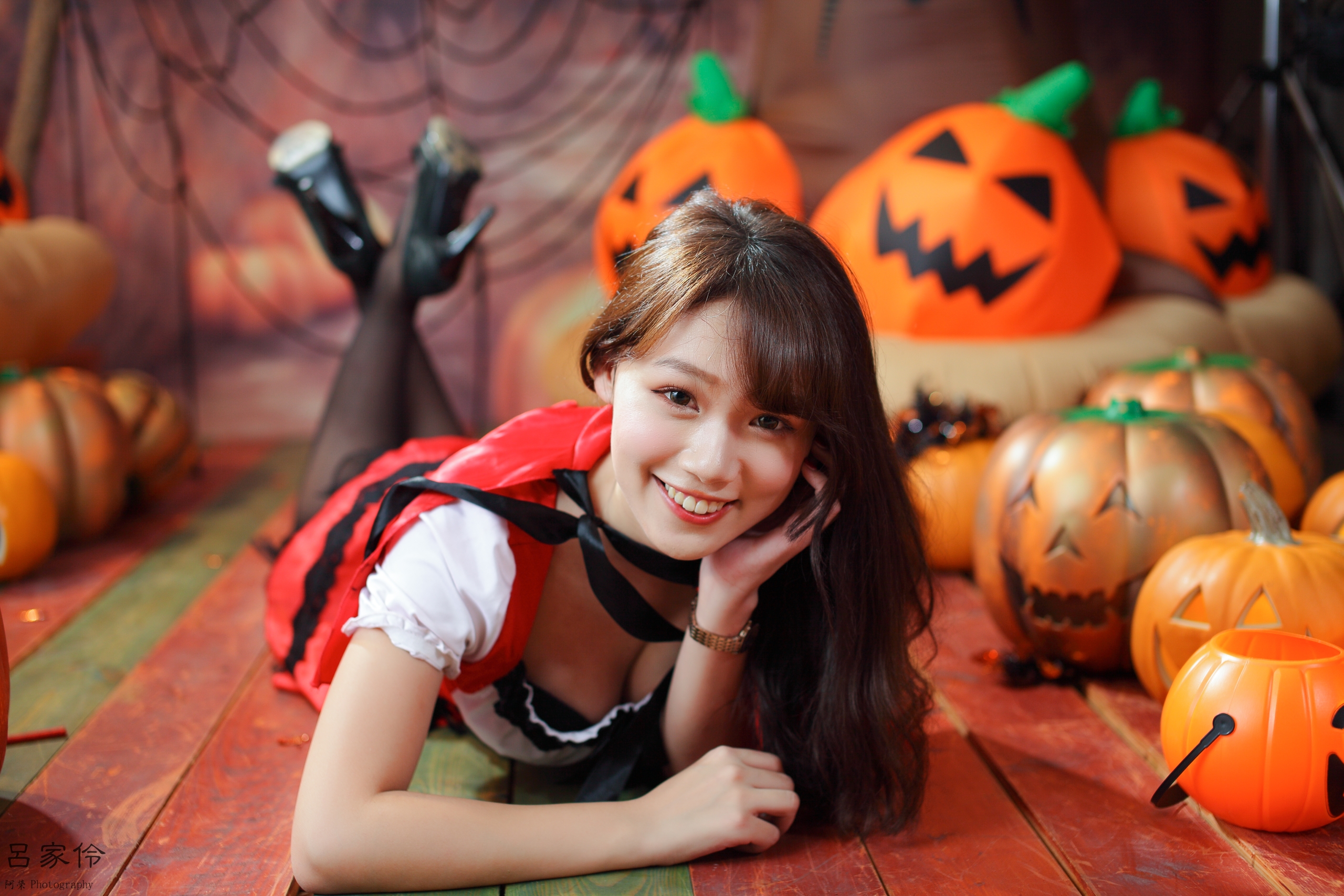 People 2560x1707 Linnnng women model Asian brunette cosplay long hair looking at viewer smiling depth of field cleavage lying on front high heels Jack O' Lantern Halloween indoors women indoors bangs touching face Chinese black hair