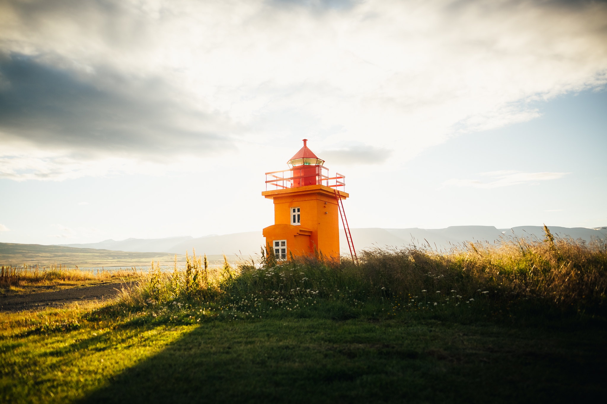 General 2048x1365 lighthouse outdoors nature orange bright sunlight grass calm