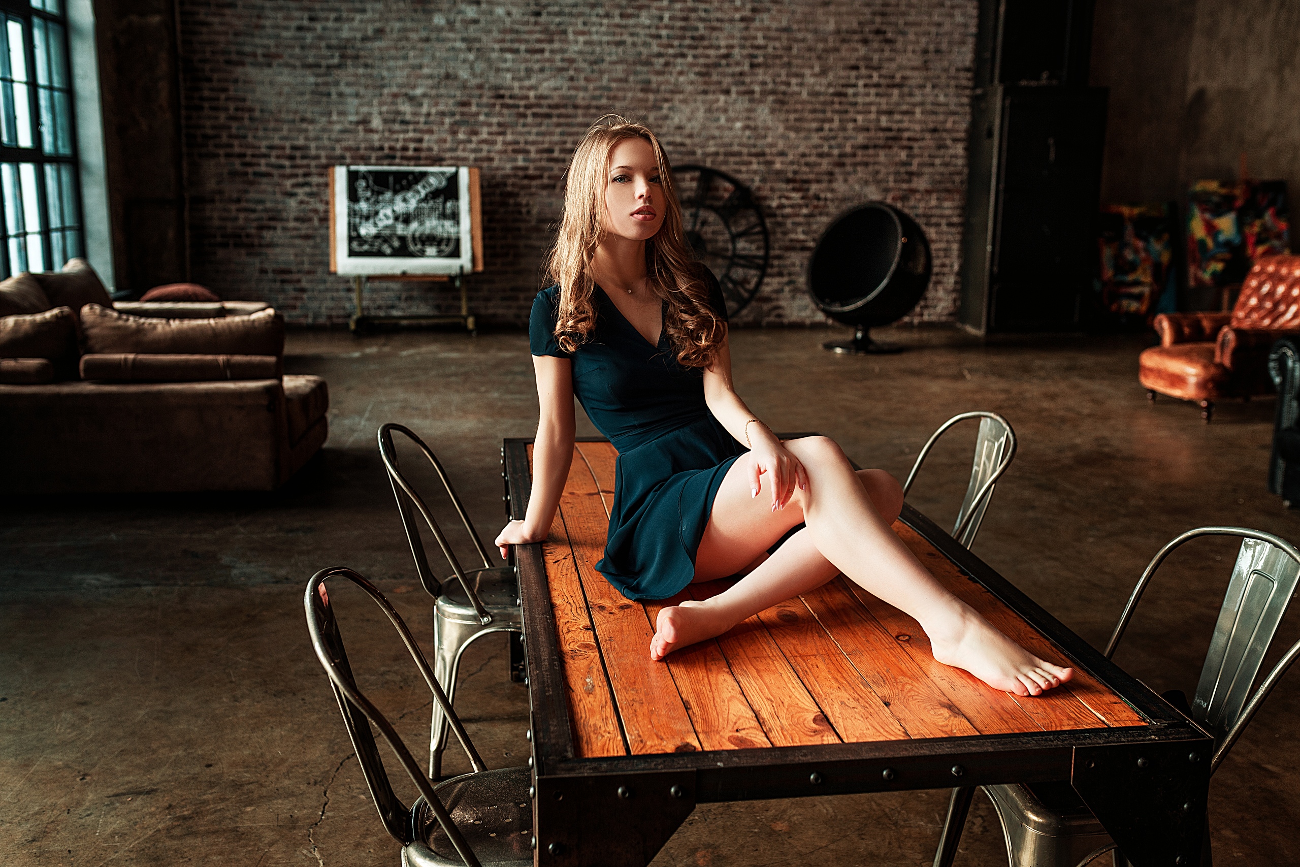 People 2560x1707 women model blonde necklace cleavage dress legs crossed indoors barefoot sitting table chair looking at viewer depth of field couch wall armchair Vlad Popov Nadezhda Smetanina tiptoe pointed toes sitting on the table on table