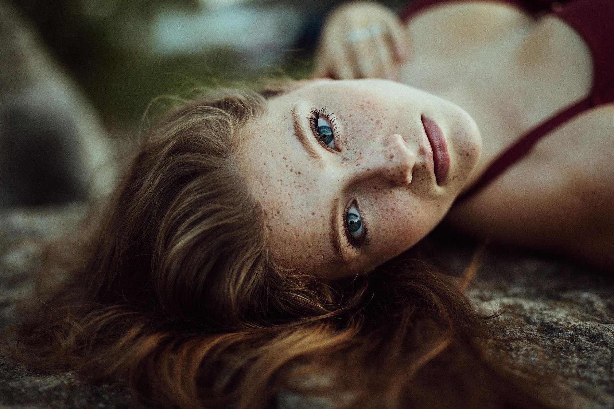 People 2000x1333 women blue eyes freckles lying on back looking at viewer face Jesse Herzog Hannah Masi closeup model women outdoors outdoors portrait cleavage long hair brunette