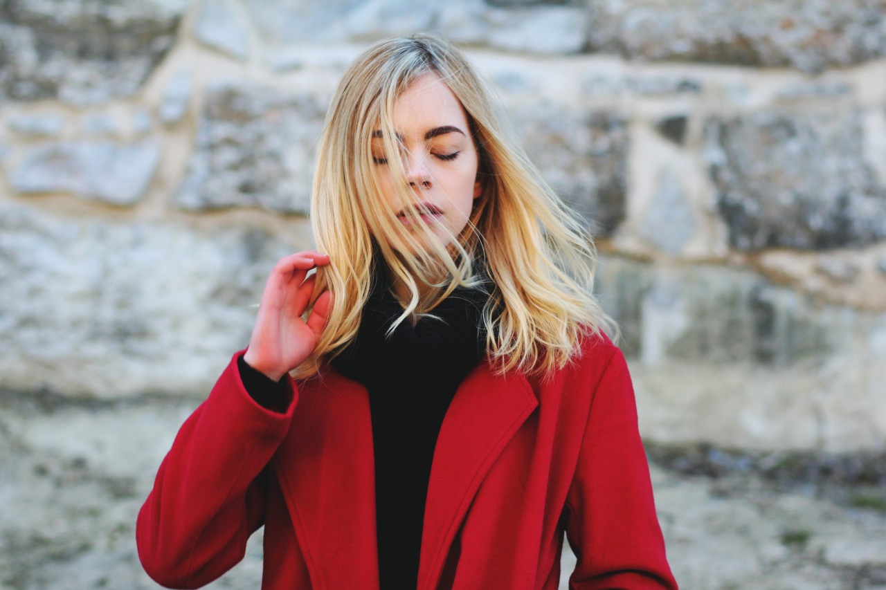 People 1280x853 women hair in face blonde closed eyes women outdoors windy hair blowing in the wind red coat coats turtlenecks sweater model red clothing