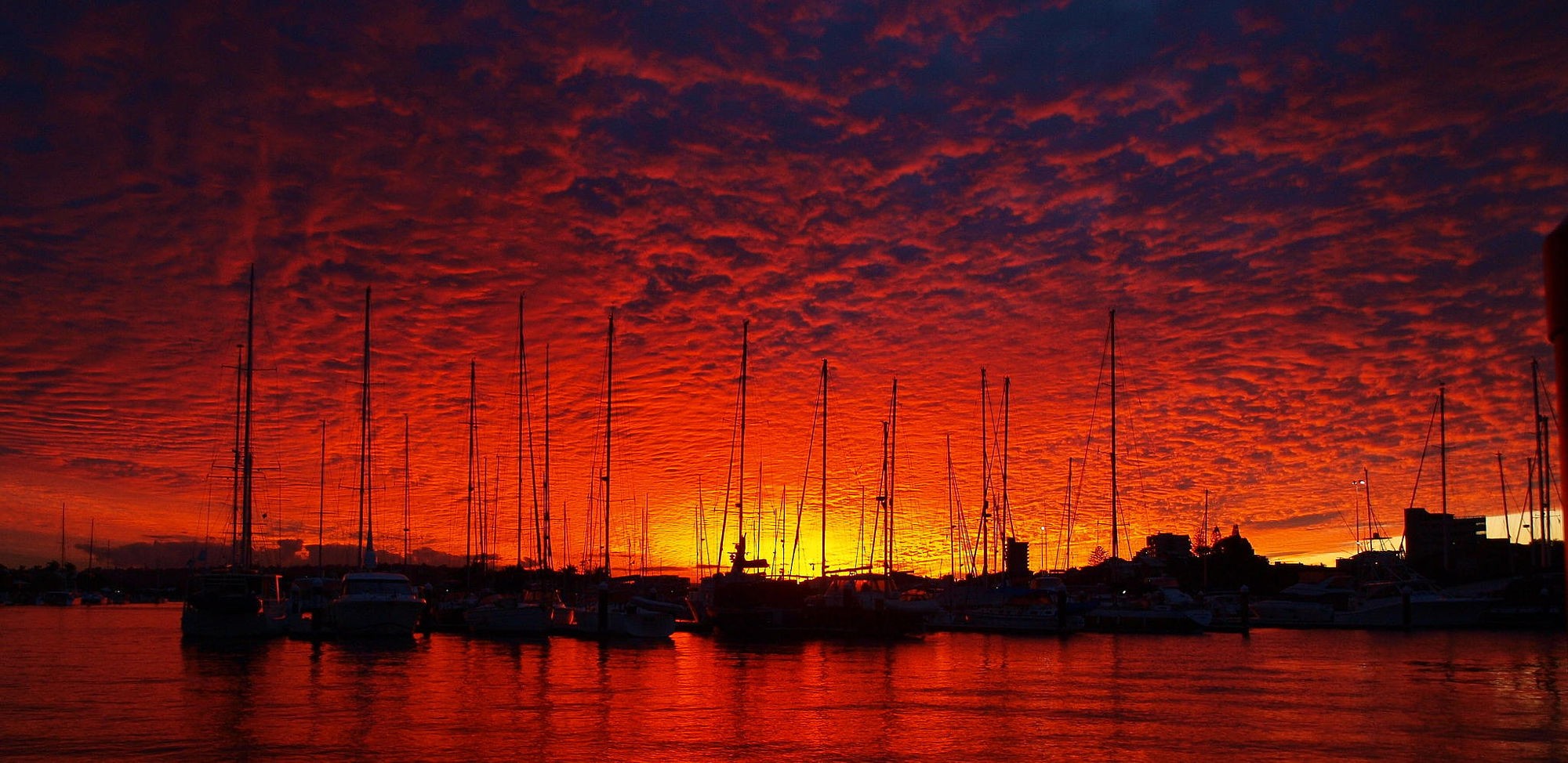 General 2000x974 sunset dock ship sky sunlight vehicle water orange sky