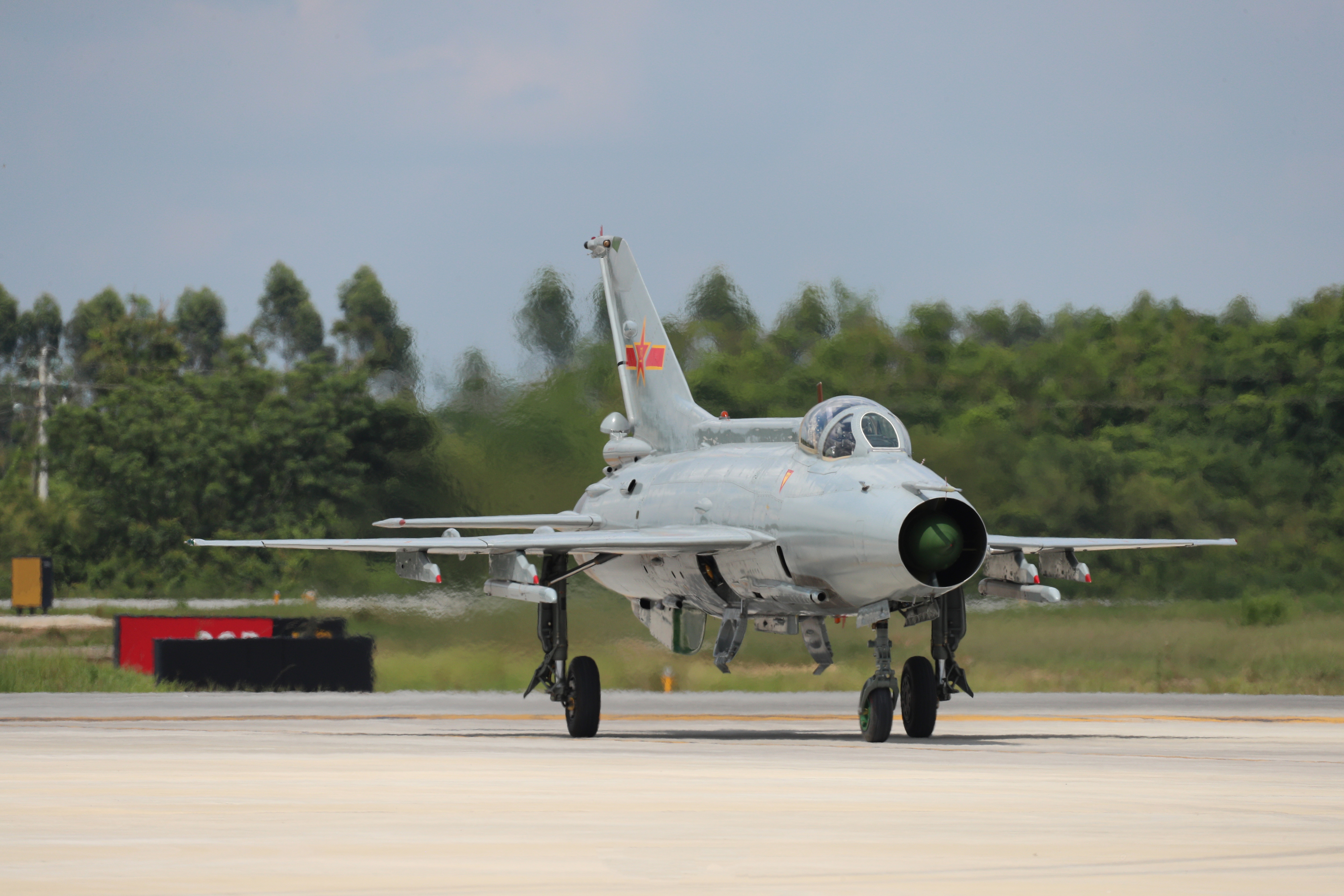 General 5472x3648 PLAAF Chengdu J-7 military military aircraft trees frontal view pilot Chinese aircraft