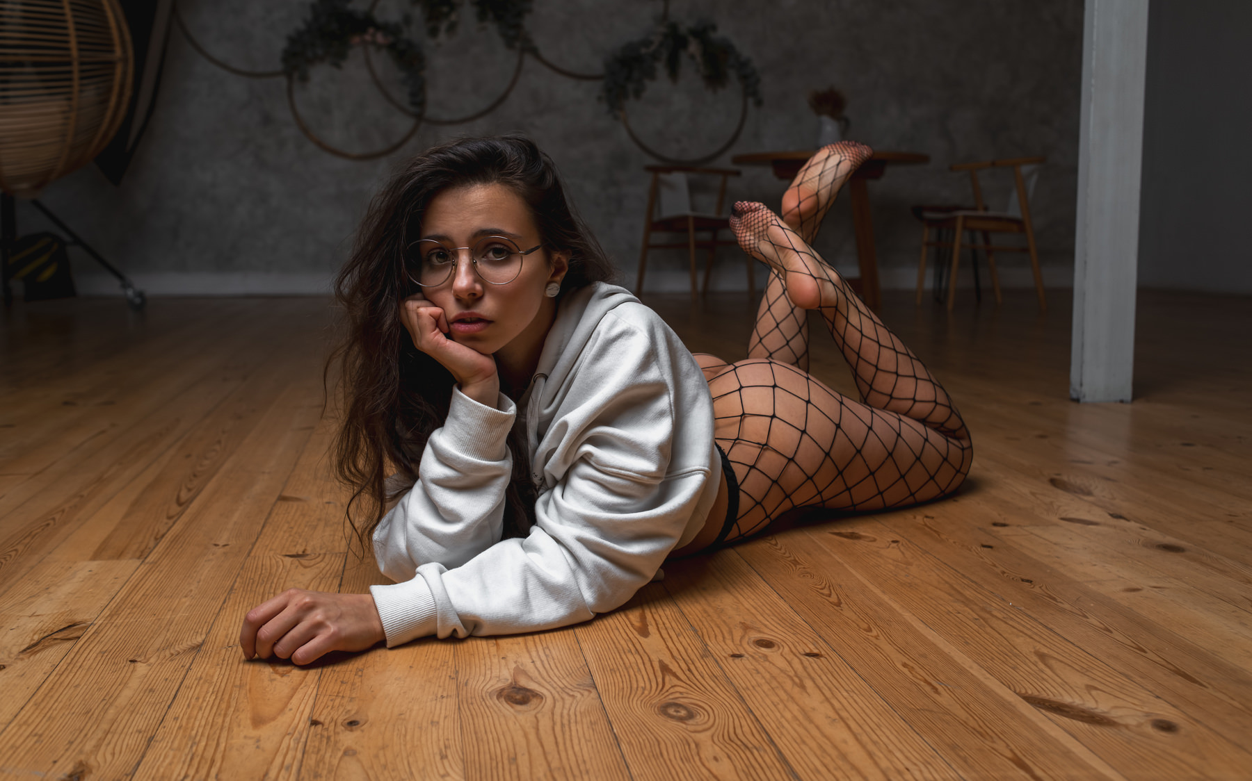 People 1800x1124 women glasses fishnet ass on the floor women with glasses feet in the air table chair women indoors white sweater sweatshirts hoods Pole Vasilkov feet lying on front floor indoors