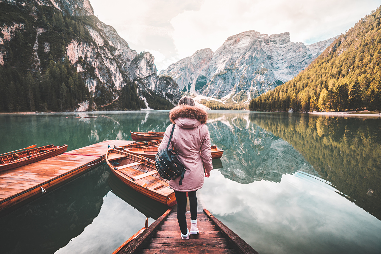 People 1280x853 model lake mountains rear view boat walking Pragser Wildsee jetty water reflection coats backpacks nature