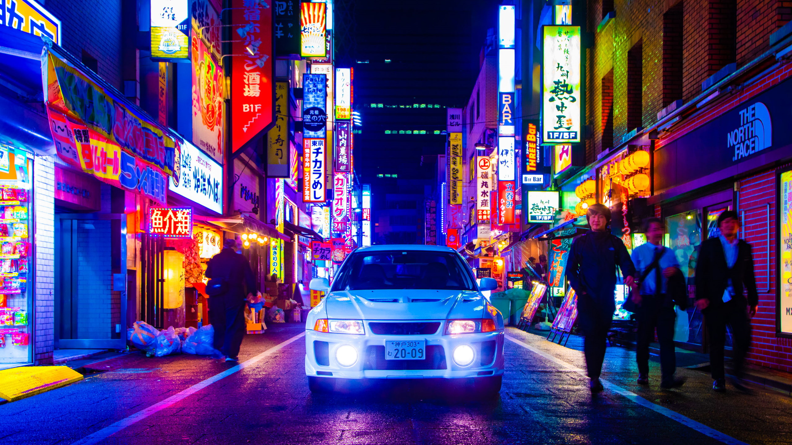 General 2560x1440 Mitsubishi Lancer Evo V Japan city neon night Japanese cars frontal view white cars headlight beams