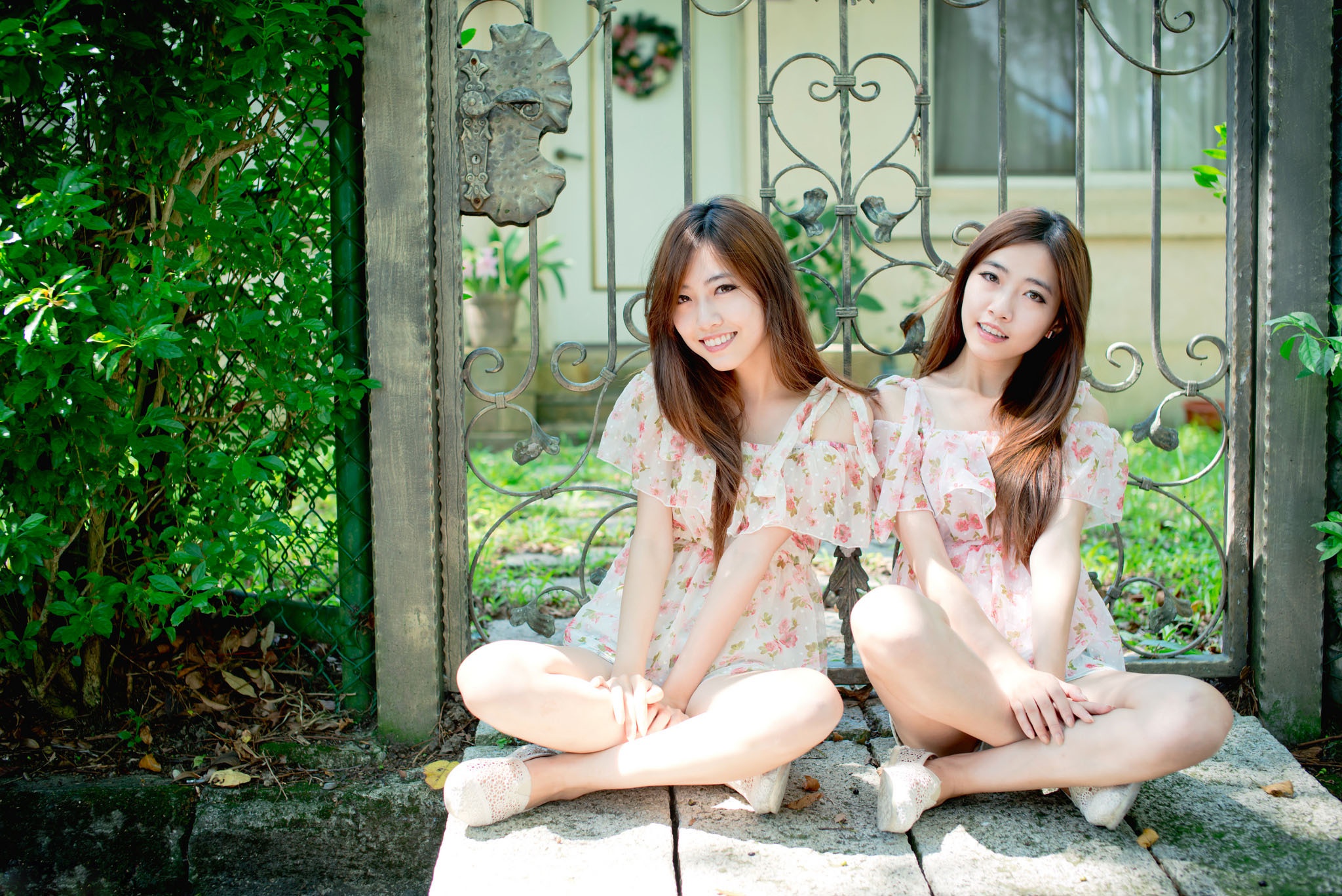 People 2048x1367 Asian model women long hair dark hair sitting legs crossed flower dress bushes depth of field house door two women