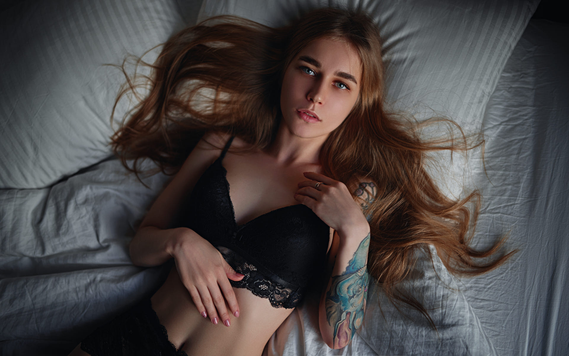 People 1920x1200 women top view Sergey Zhirnov belly black lingerie tattoo painted nails pillow in bed lying on back portrait long hair