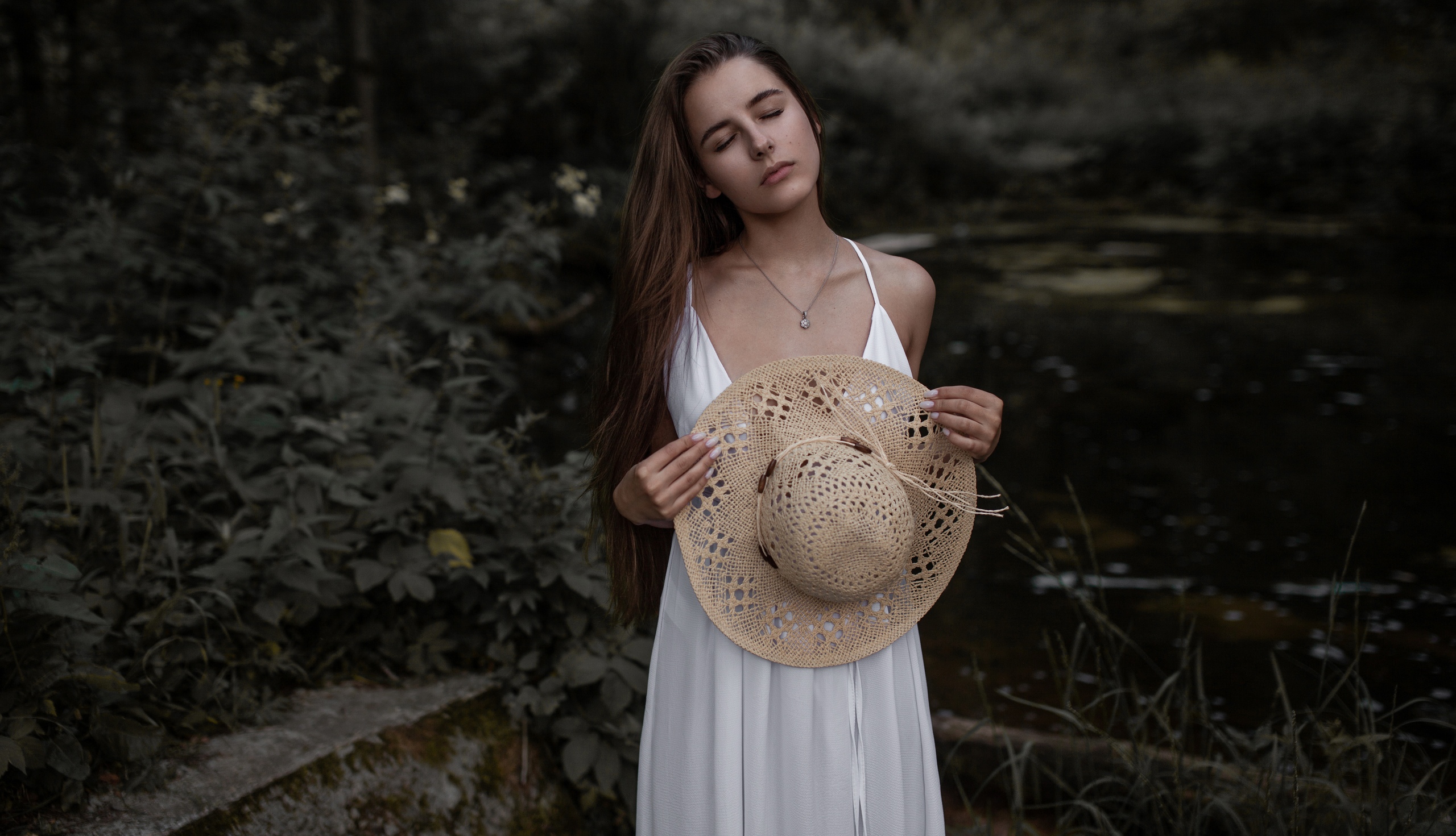 People 2560x1471 women model brunette long hair hat cleavage necklace dress white dress forest outdoors women outdoors closed eyes portrait depth of field painted nails Andrey Frolov no bra Tatiana Vanyasheva