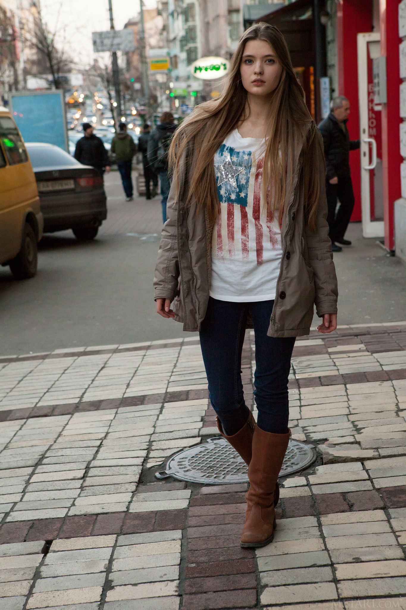 People 1365x2048 women blonde model Sigrid grey jacket public women outdoors long hair open jacket jacket MetArt T-shirt white t-shirt straight hair looking at viewer leather boots brown boots blue  jeans blue pants Ukraine