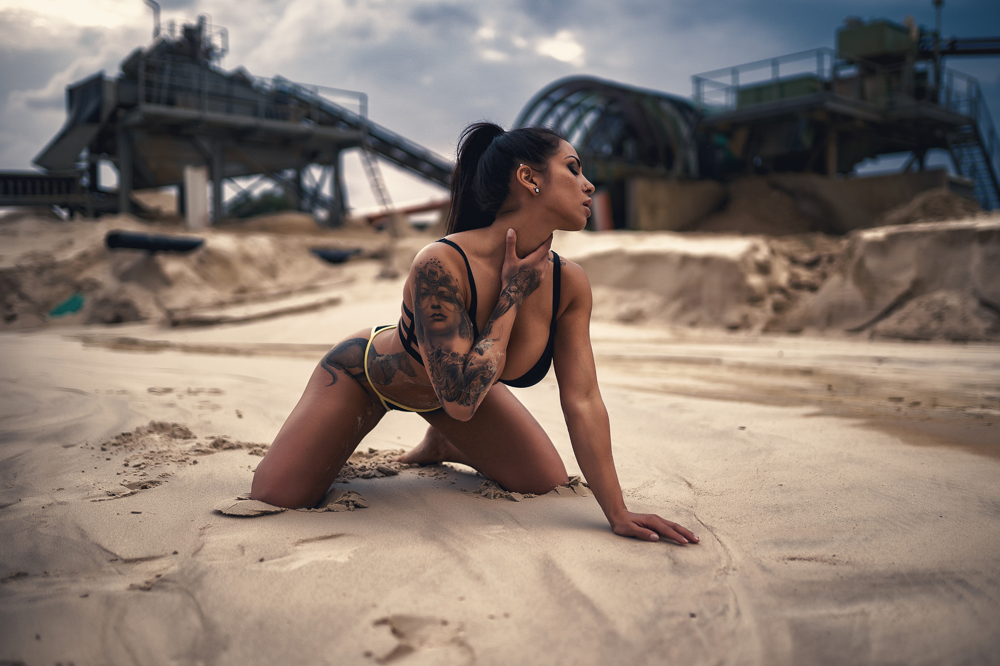 People 2048x1365 women tanned sand bikini sand covered kneeling nose ring tattoo women outdoors depth of field