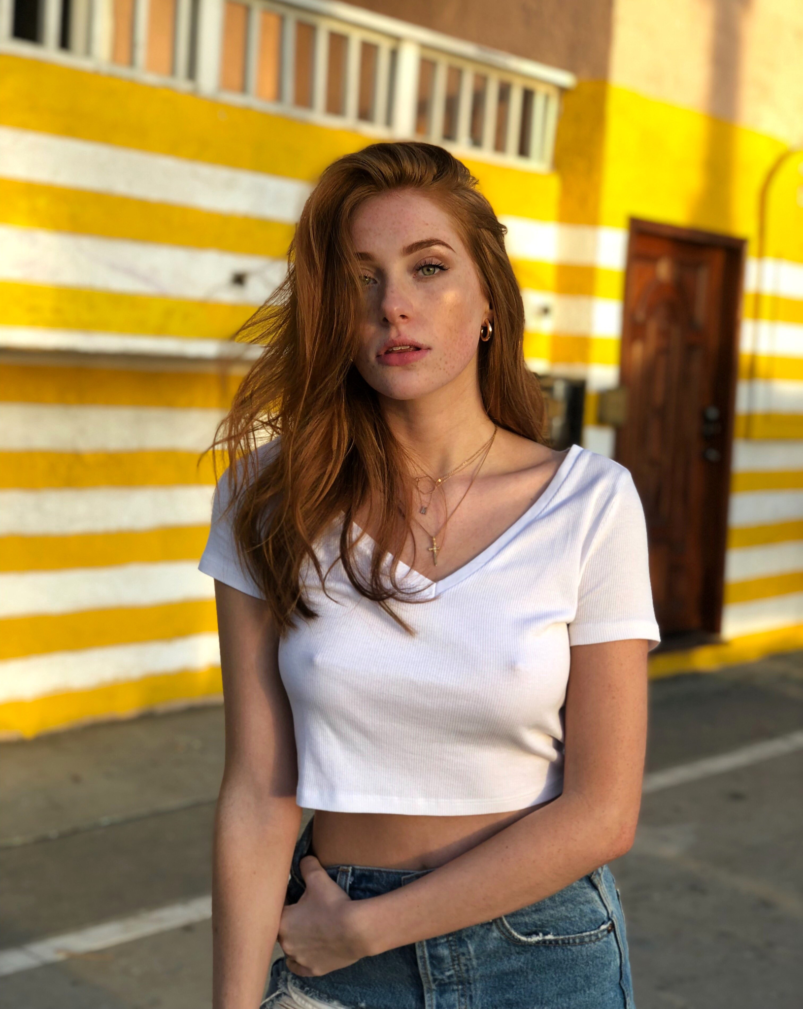 People 1630x2048 Madeline Ford women redhead model long hair freckles looking at viewer parted lips necklace white tops nipple bulge no bra jeans torn jeans street depth of field portrait display outdoors women outdoors crucifix necklace nipples through clothing