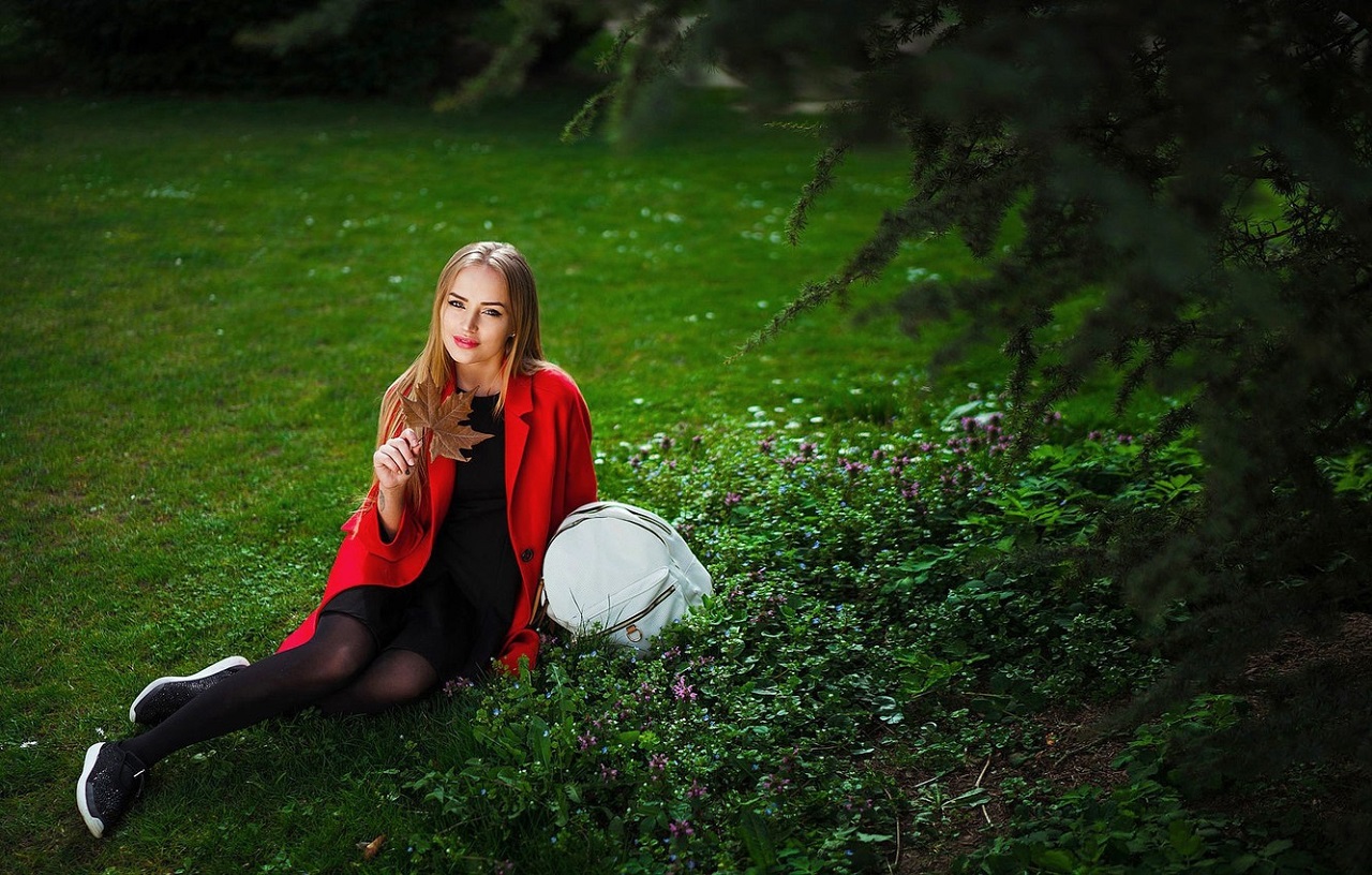 People 1280x816 blonde women model Maria Puchnina women outdoors red jackets black dress jacket legs together Russian model Russian Russian women long hair straight hair makeup red coat open coat coats sneakers classy fashion park sitting on the ground backpacks tight dress Ivan Gorokhov