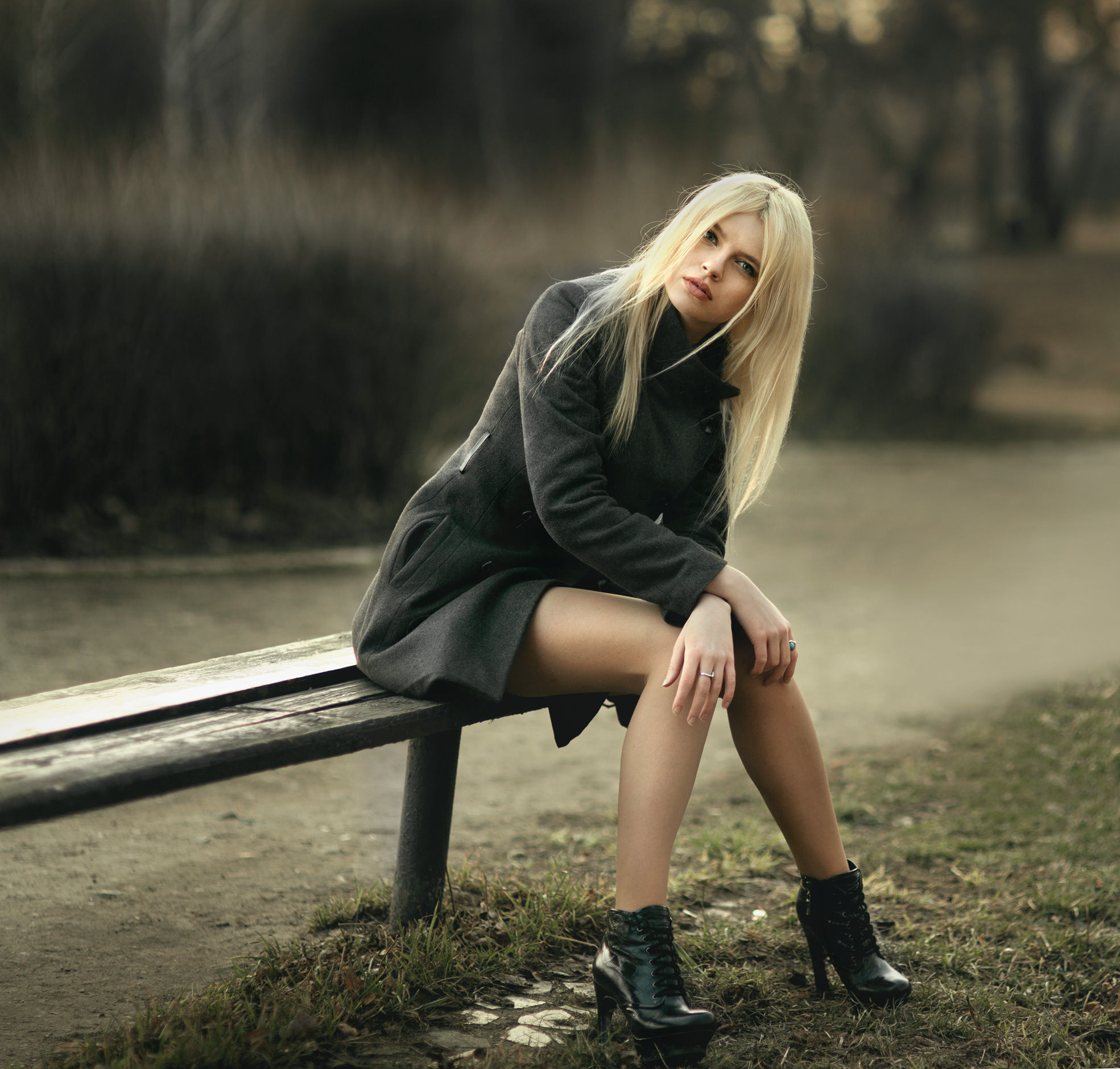 People 1969x1880 women model blonde black coat sitting long hair straight hair bench looking at viewer women outdoors hair in face legs high heels hands on knees on bench