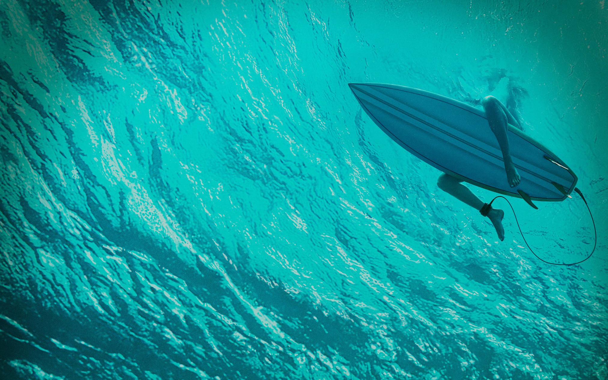 General 2025x1266 sea surfers legs underwater water waves surfboards turquoise cyan