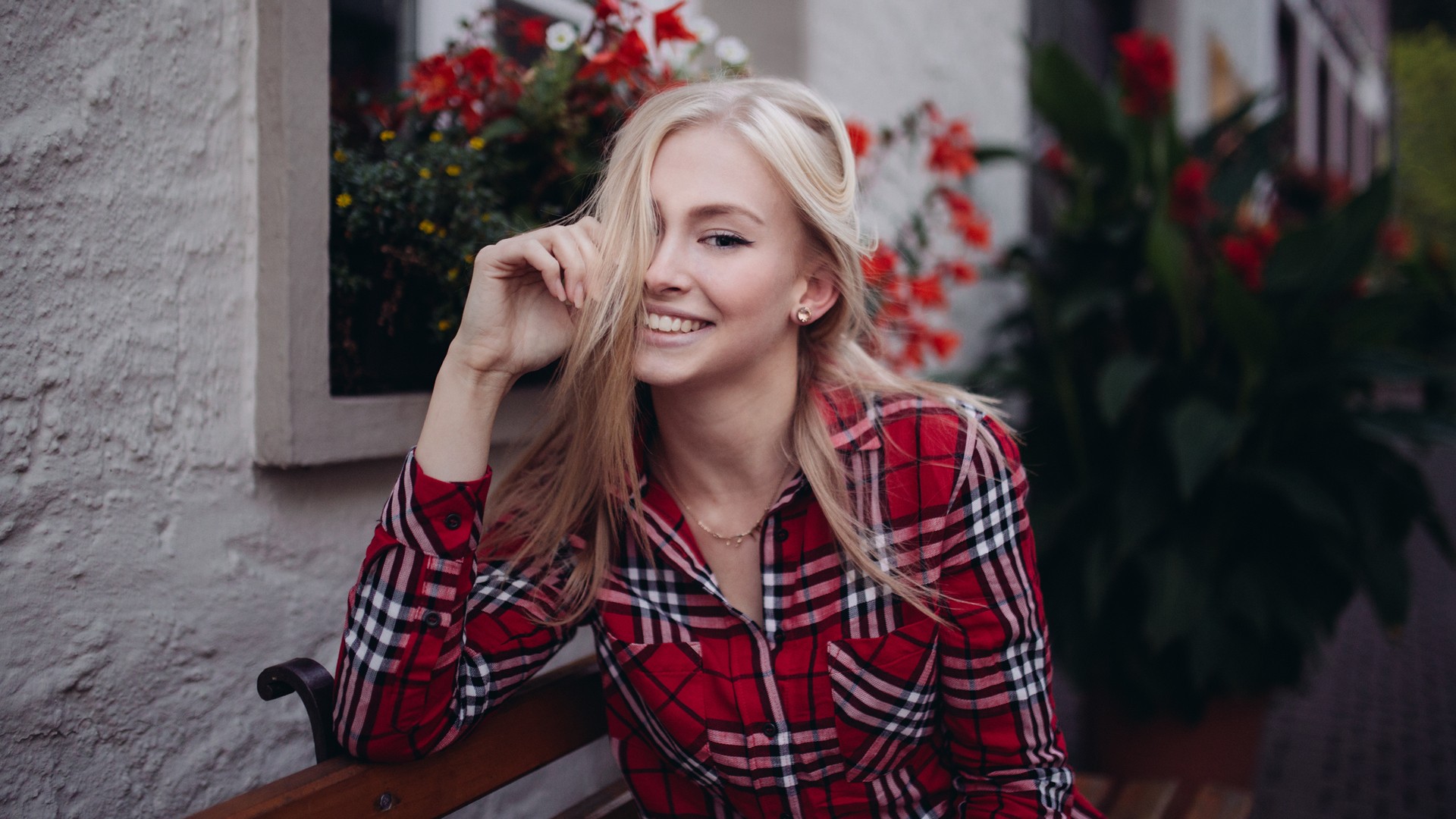People 1920x1080 women model blonde long hair looking at viewer smiling checkered shirt women outdoors flowers house hair in face bench sitting plaid shirt red shirt hair over one eye on bench