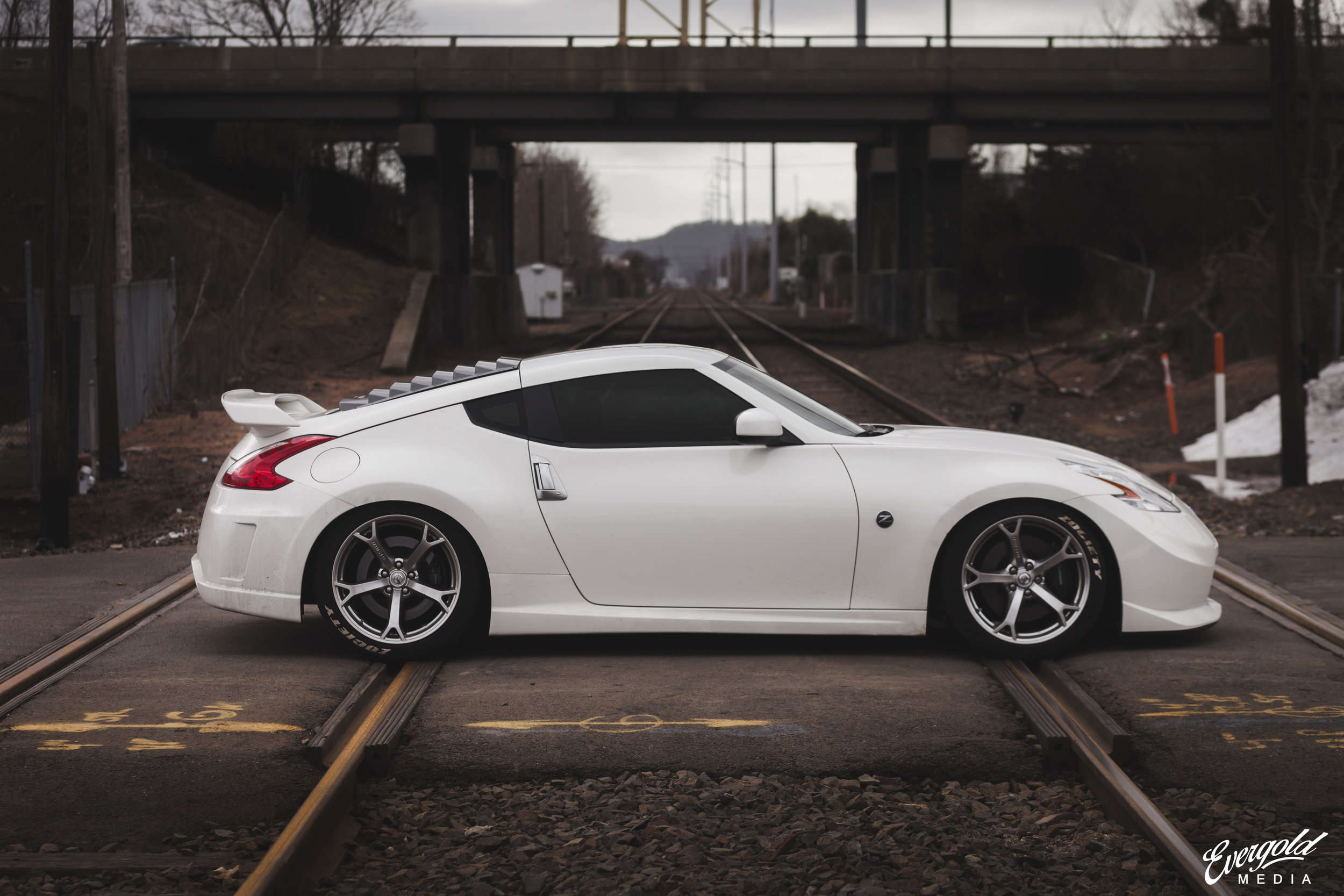 General 2500x1667 railway railway crossing white cars Nissan 370Z Nissan Fairlady Z Nissan Japanese cars sports car car watermarked side view vehicle