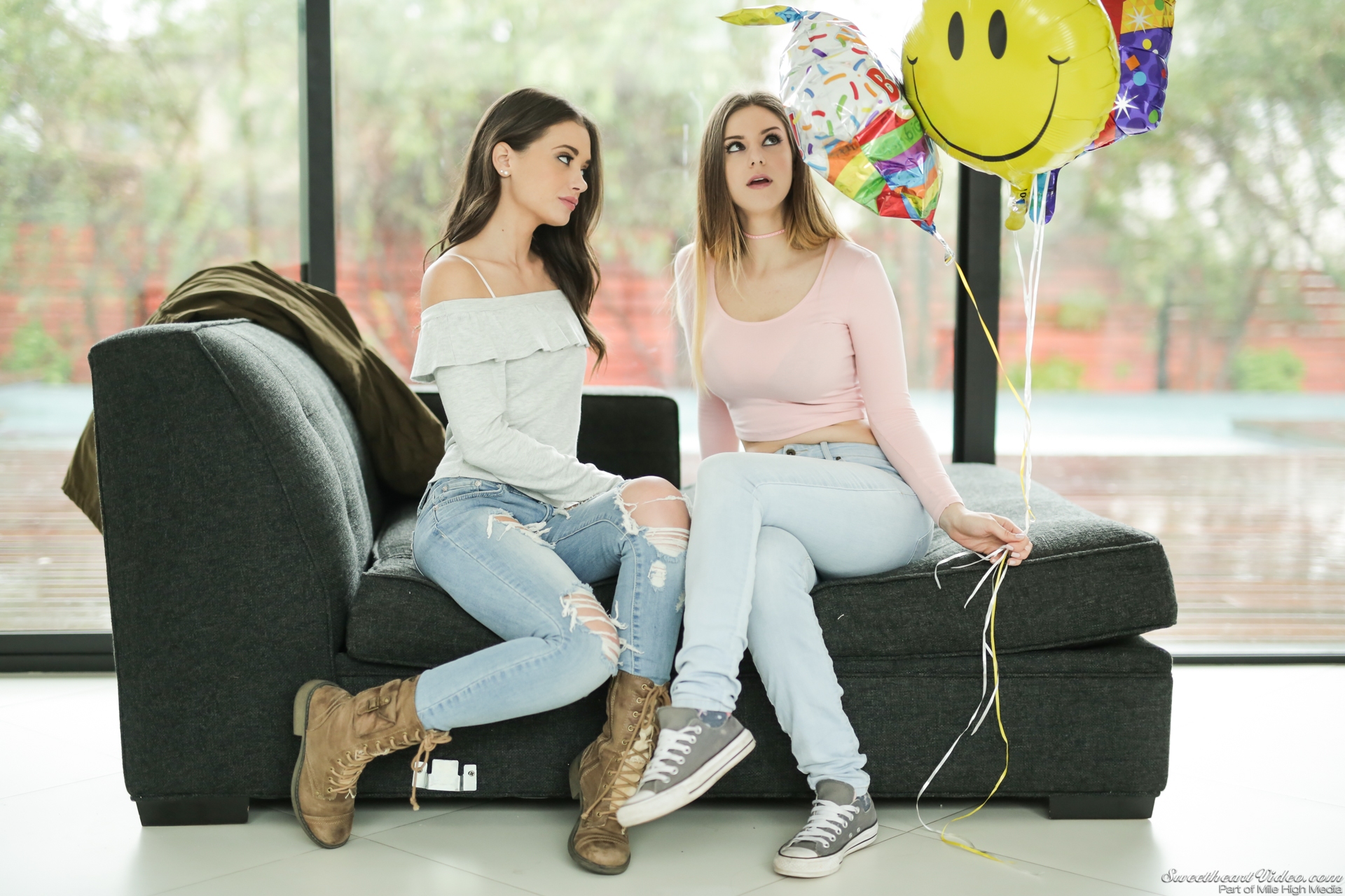 People 1920x1280 women Stella Cox Gia Paige torn jeans pink tops sitting pornstar SweetheartVideo sweatshirts crop top grey sofa brown boots looking up blue pants balloon sneakers Mile High Media