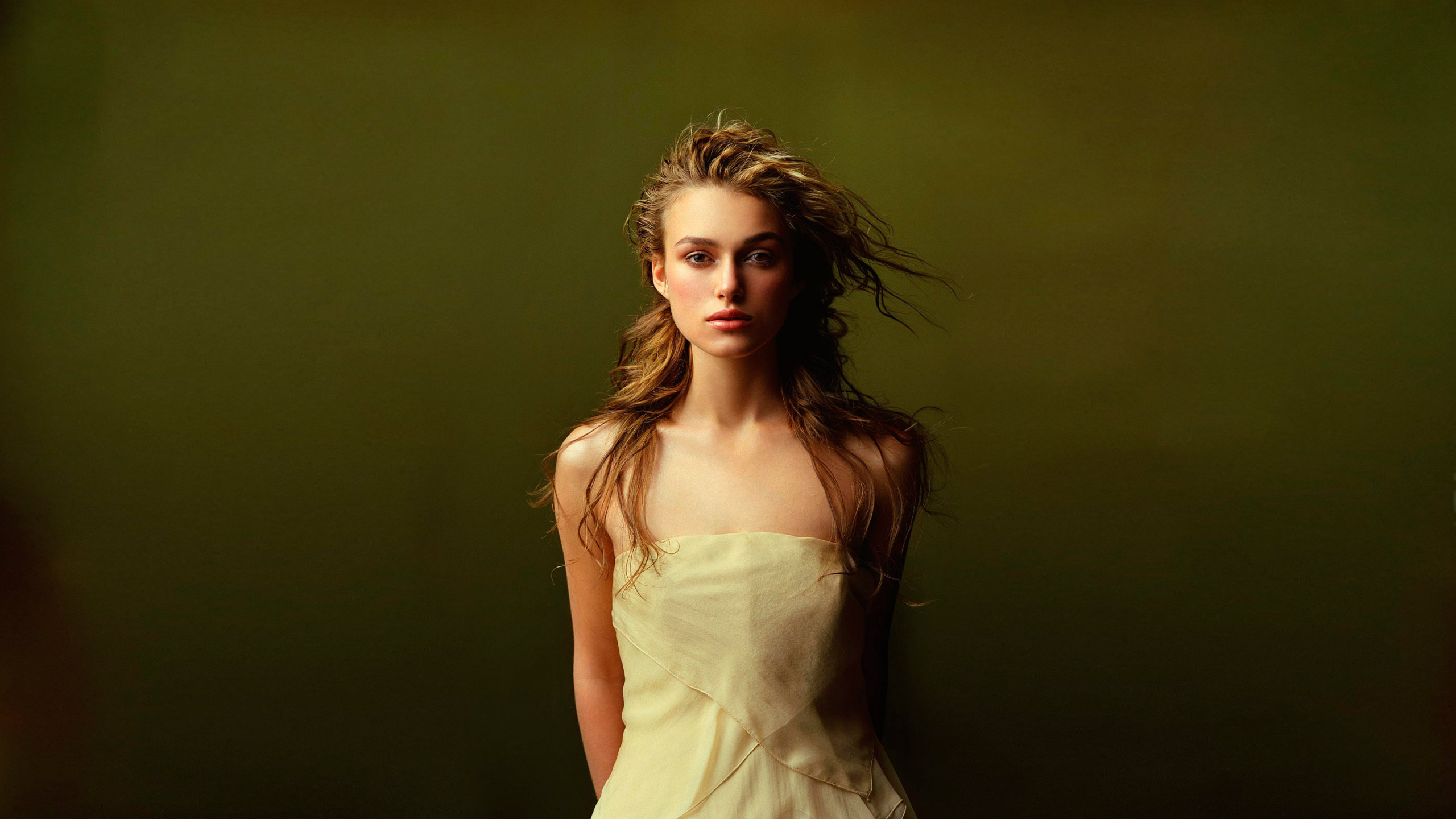 People 2560x1440 Keira Knightley actress looking at viewer women frontal view women indoors indoors strapless dress long hair studio green background British women