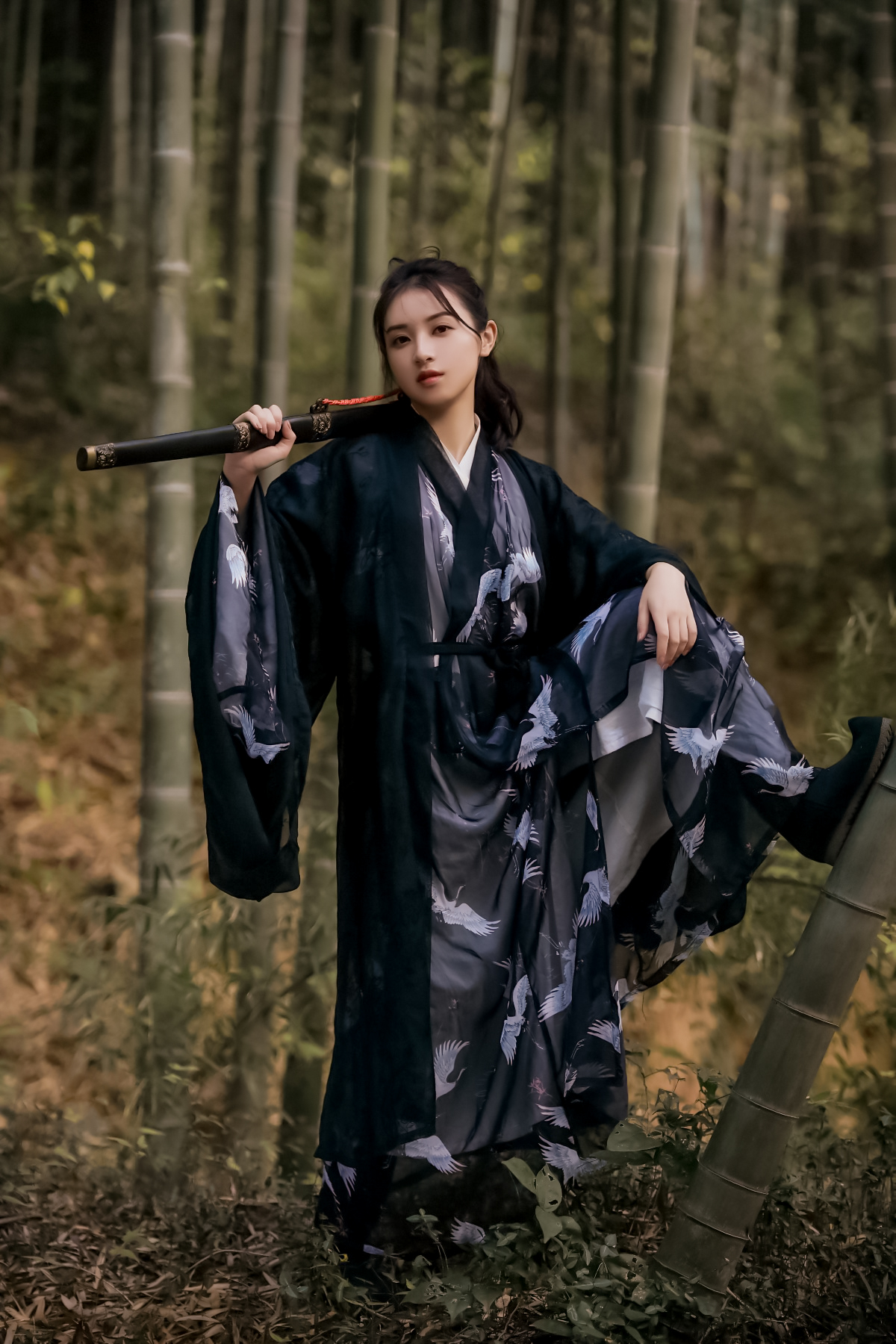 People 1200x1800 women model Chinese model cosplay katana brunette long hair chinese dress tied hair hair in face looking at viewer bamboo forest Asian